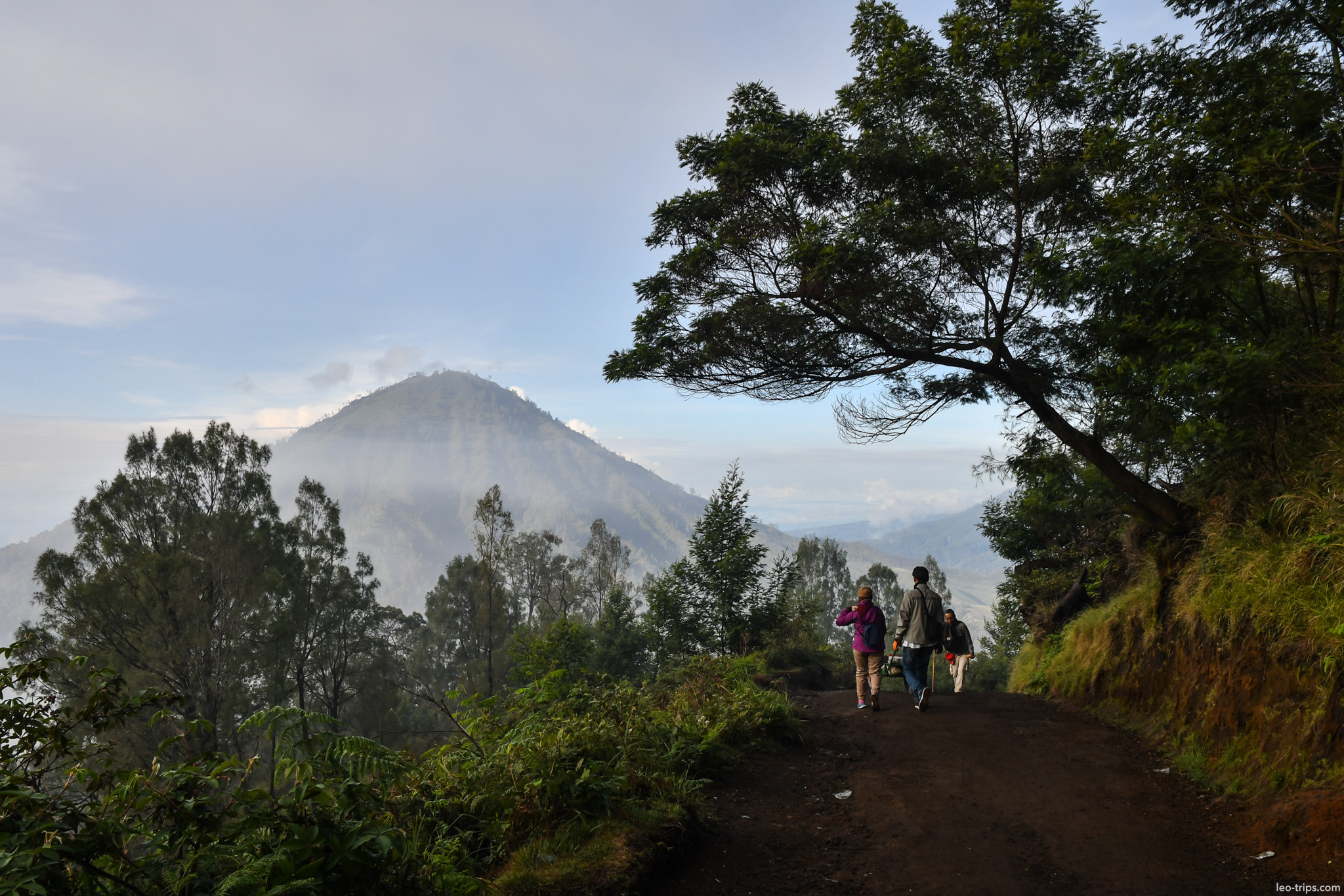 hikers descending trail with volcano view ijen ijen lake