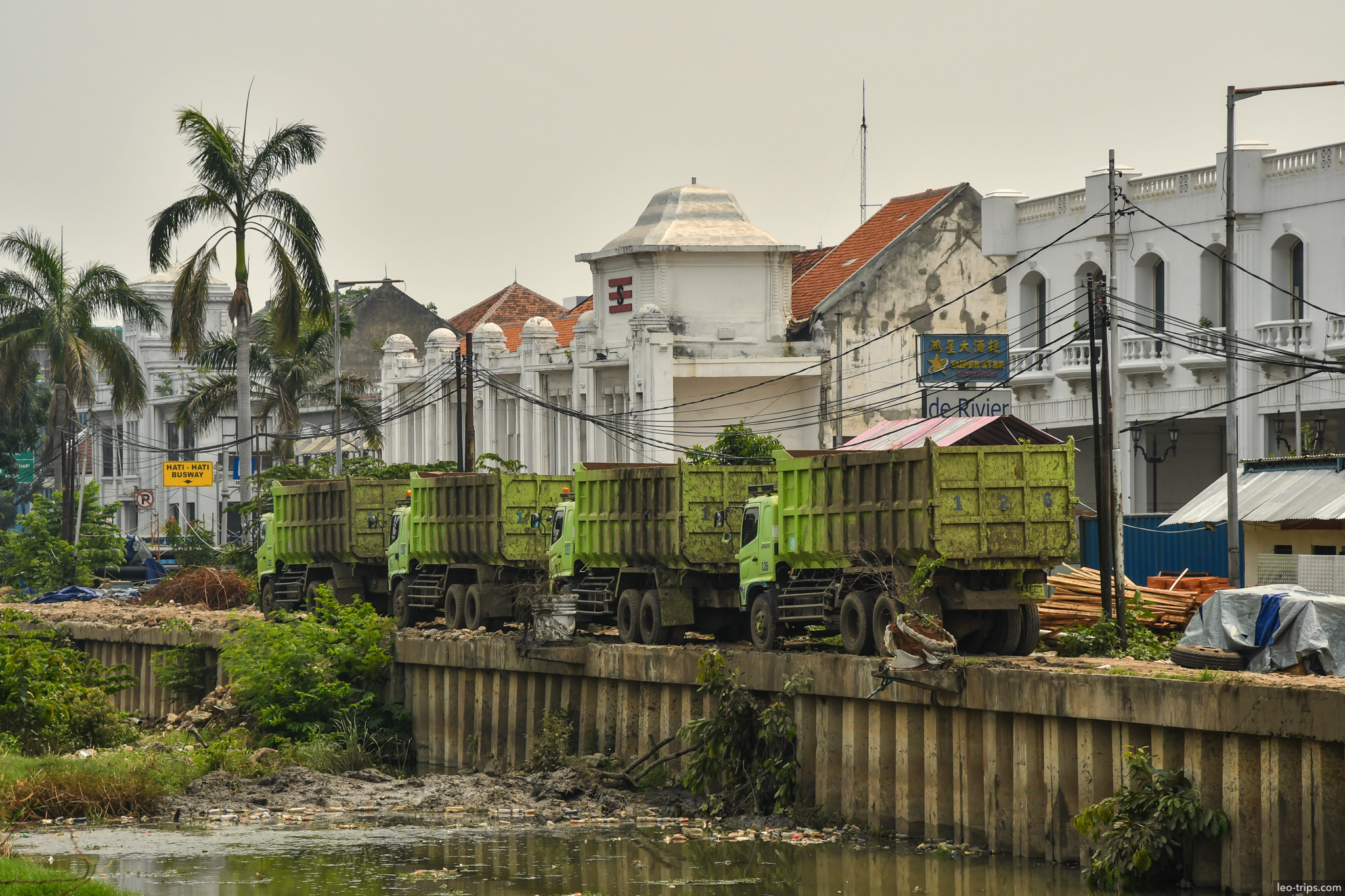 dump trucks colonial buildings riverside kota tua jakarta