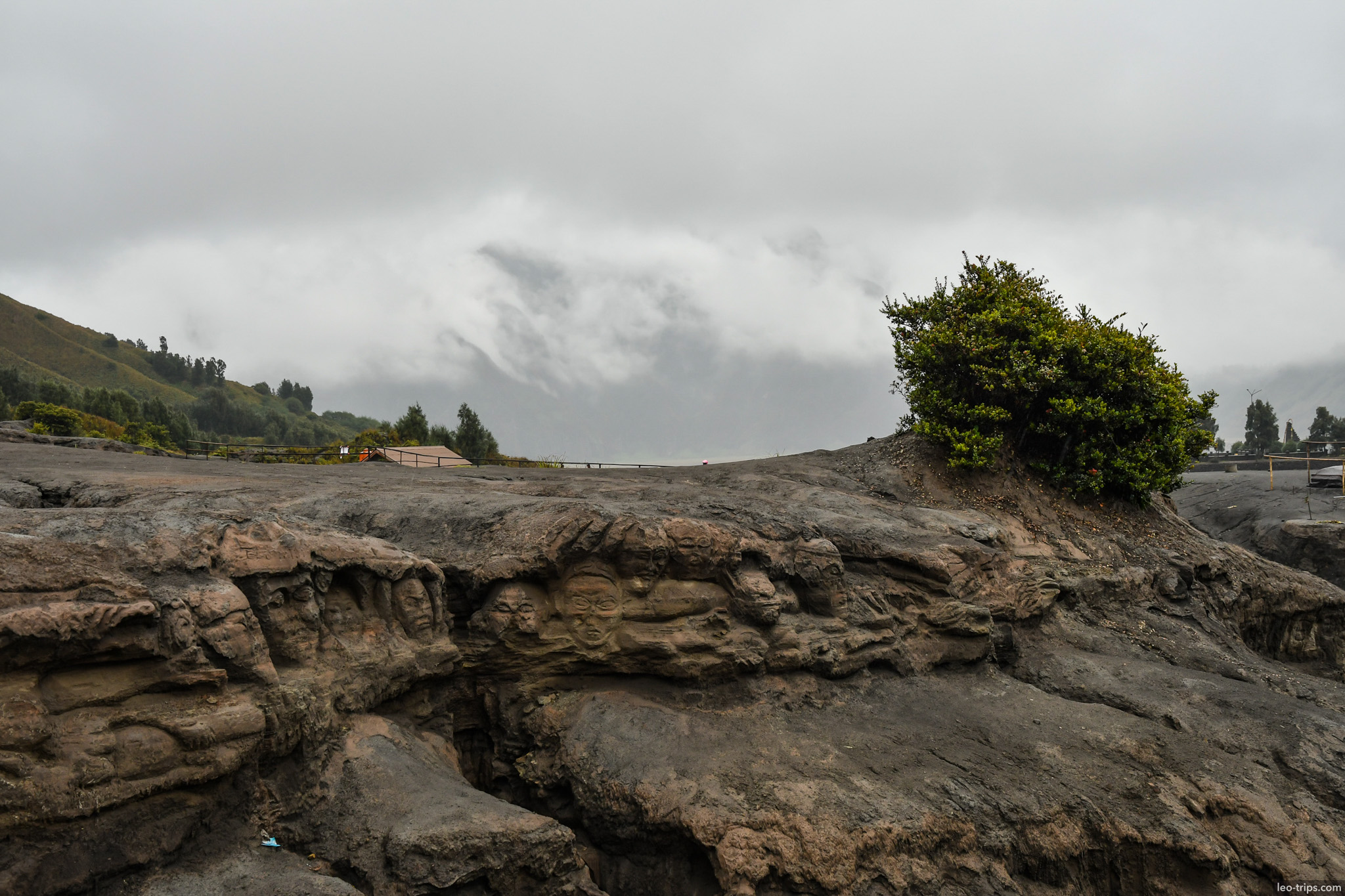 carved stone faces in volcanic rock bromo mount bromo