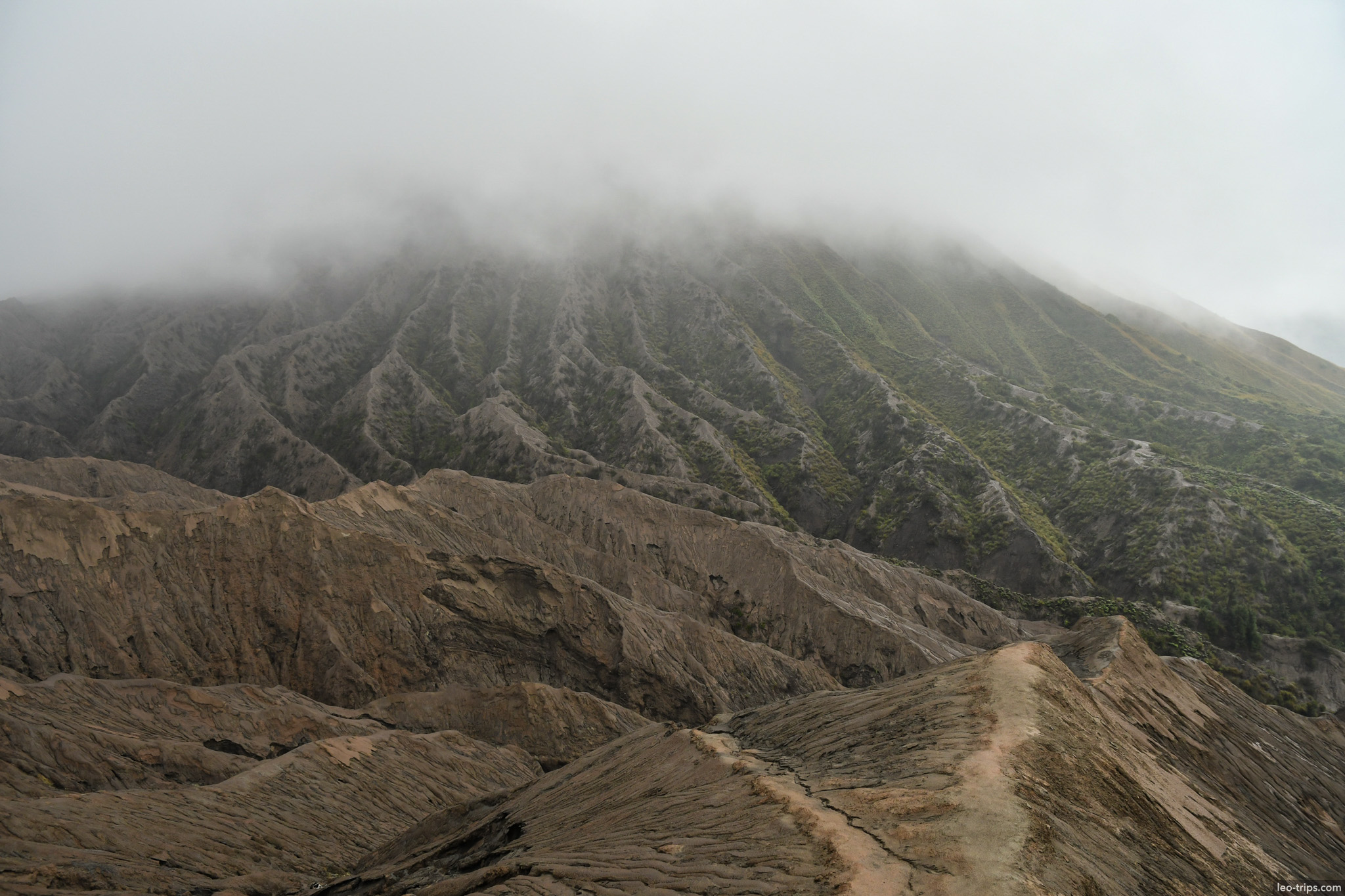 eroded ridges and cloud covered peak bromo mount bromo