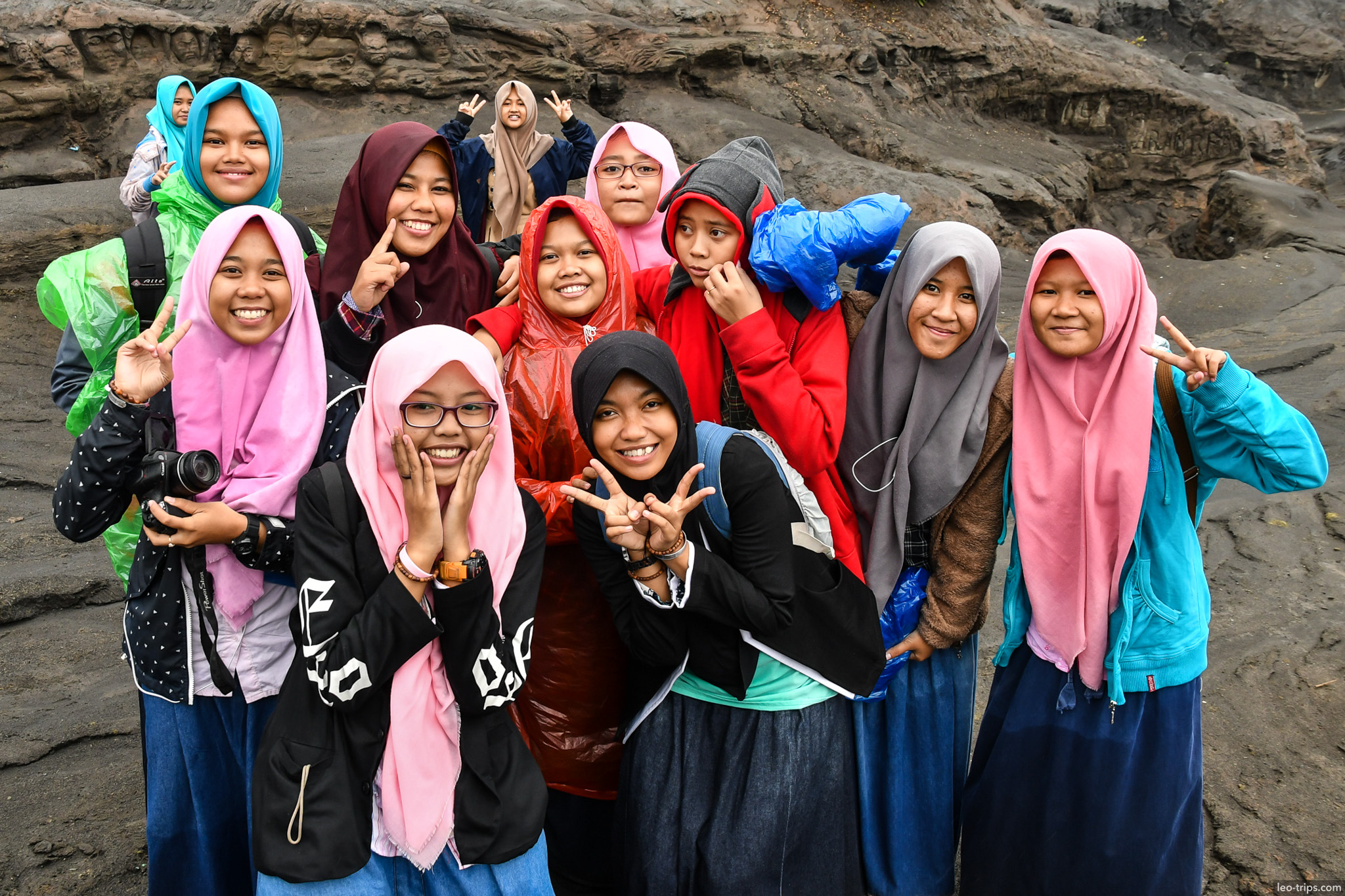 group of girls posing at volcanic canyon mount bromo