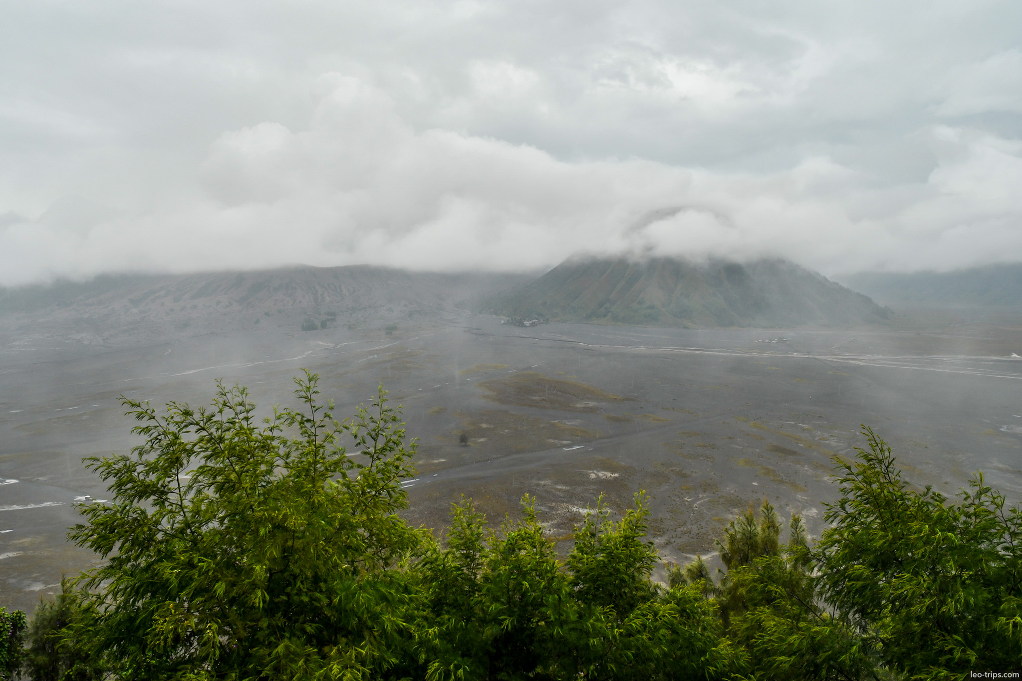 misty panorama of mount batok from caldera rim mount bromo