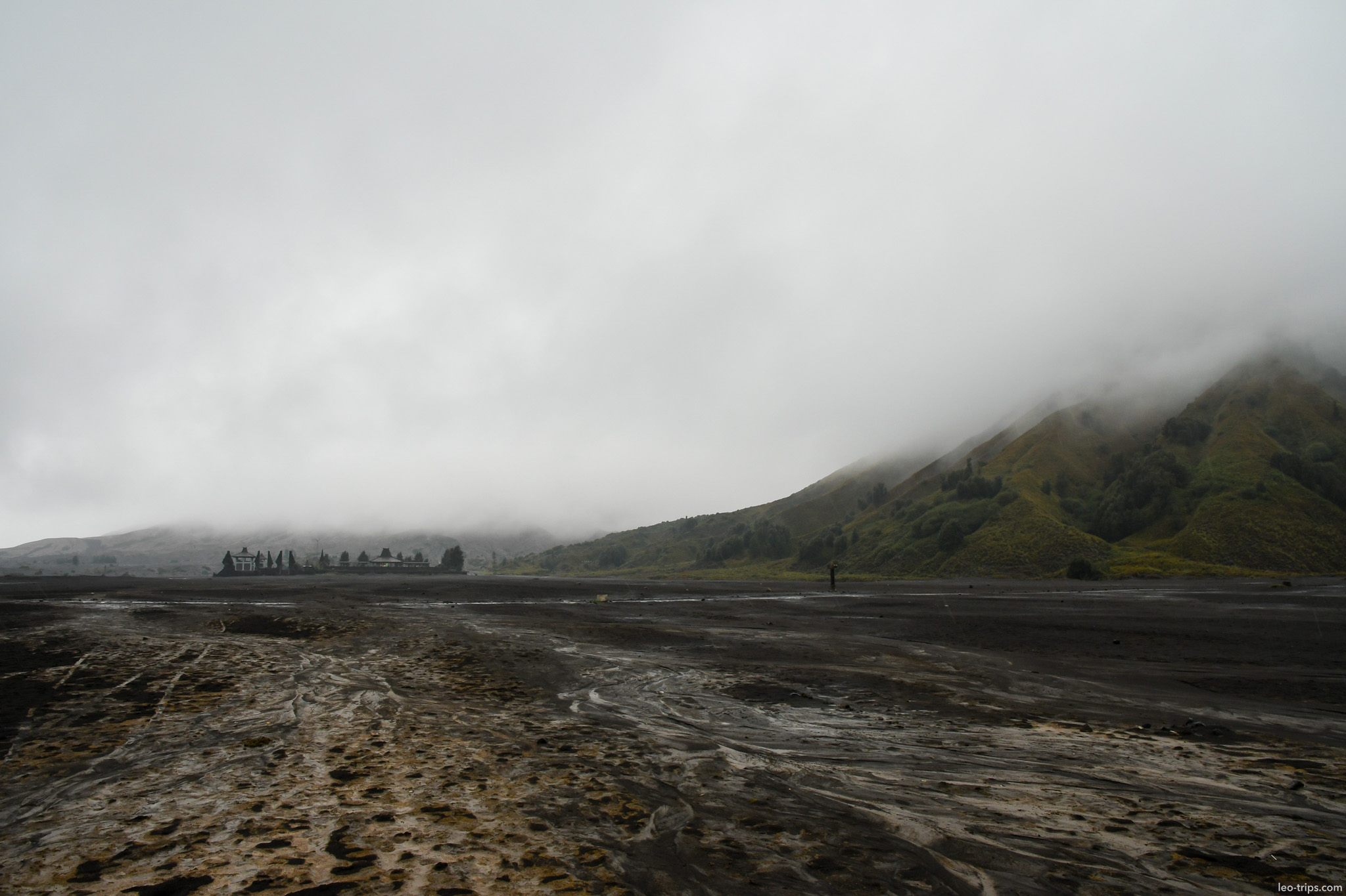 misty volcanic plain and green hills tengger mount bromo