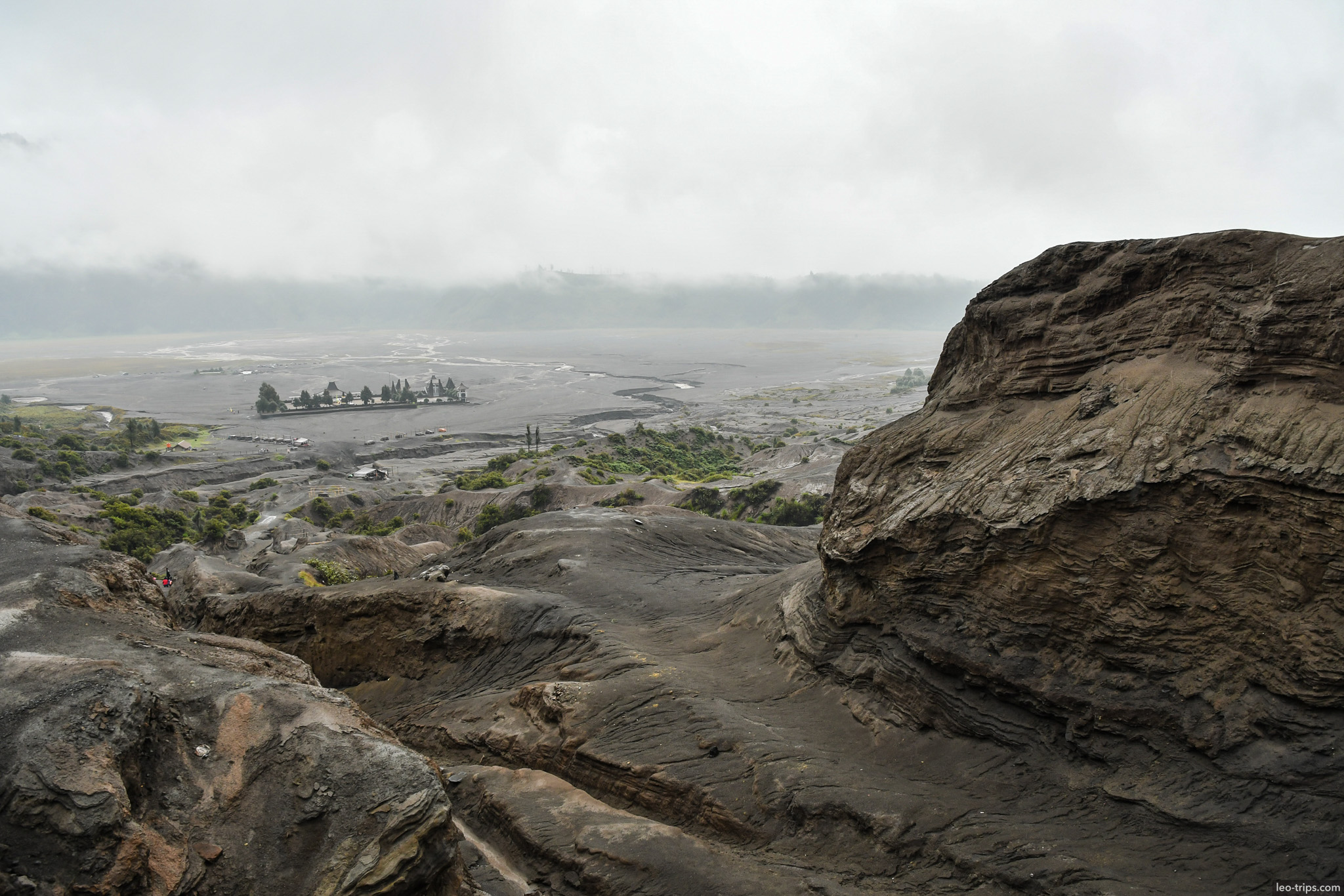 sea of sand and pura luhur poten from above mount bromo