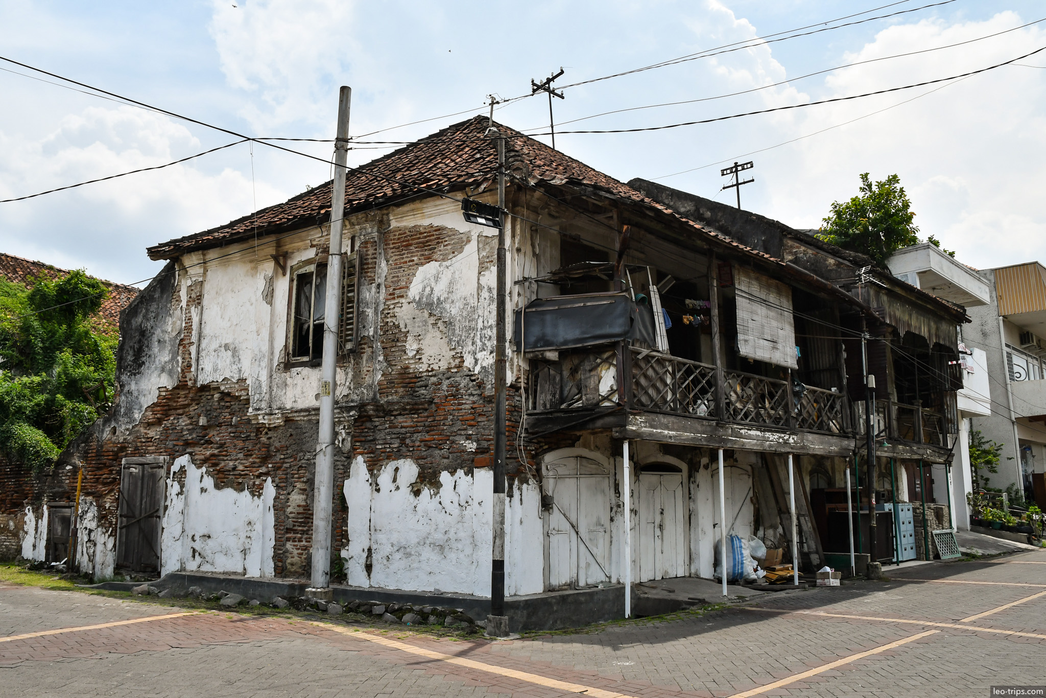 dilapidated two story colonial house wooden balcony semarang