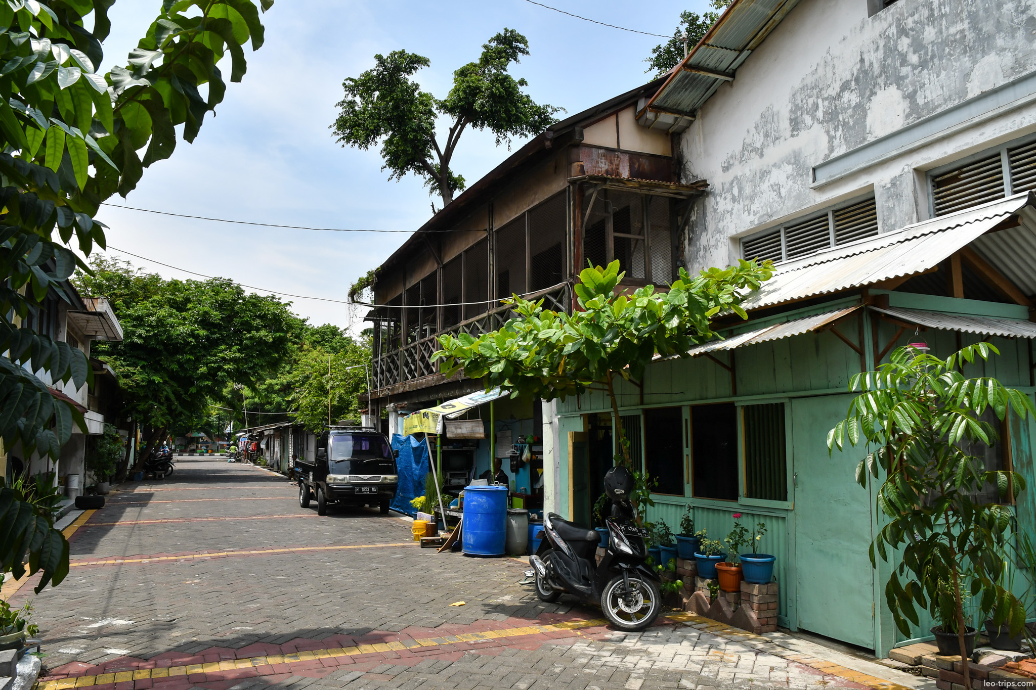 quiet residential lane colonial buildings greenery semarang