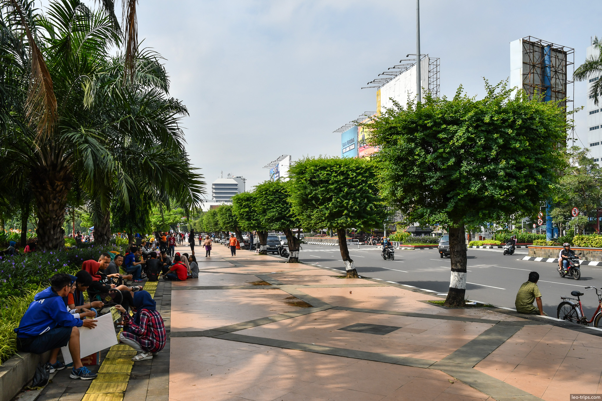 tree lined boulevard people relaxing semarang semarang
