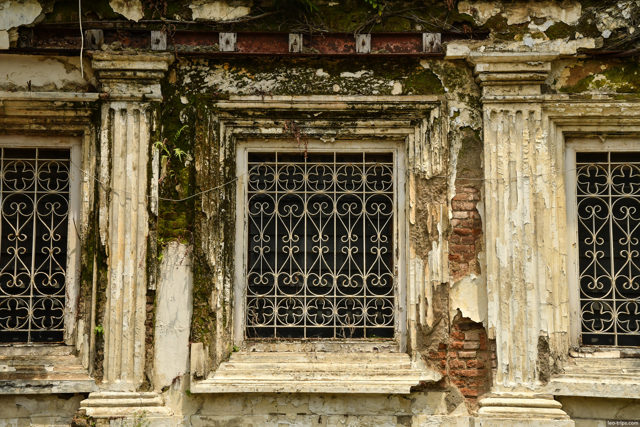 weathered colonial window iron grille closeup semarang