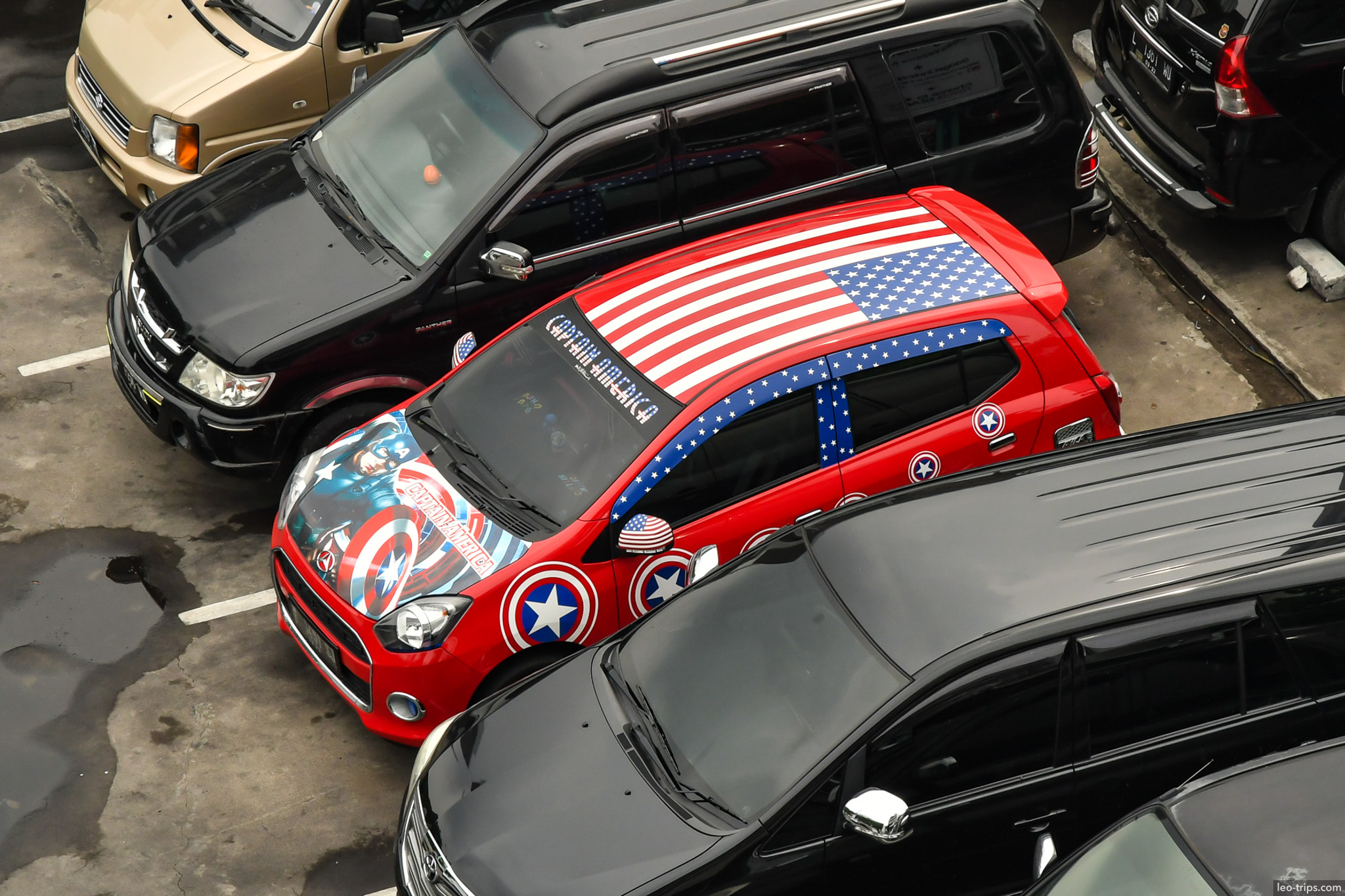 american flag themed car aerial view parking lot surabaya