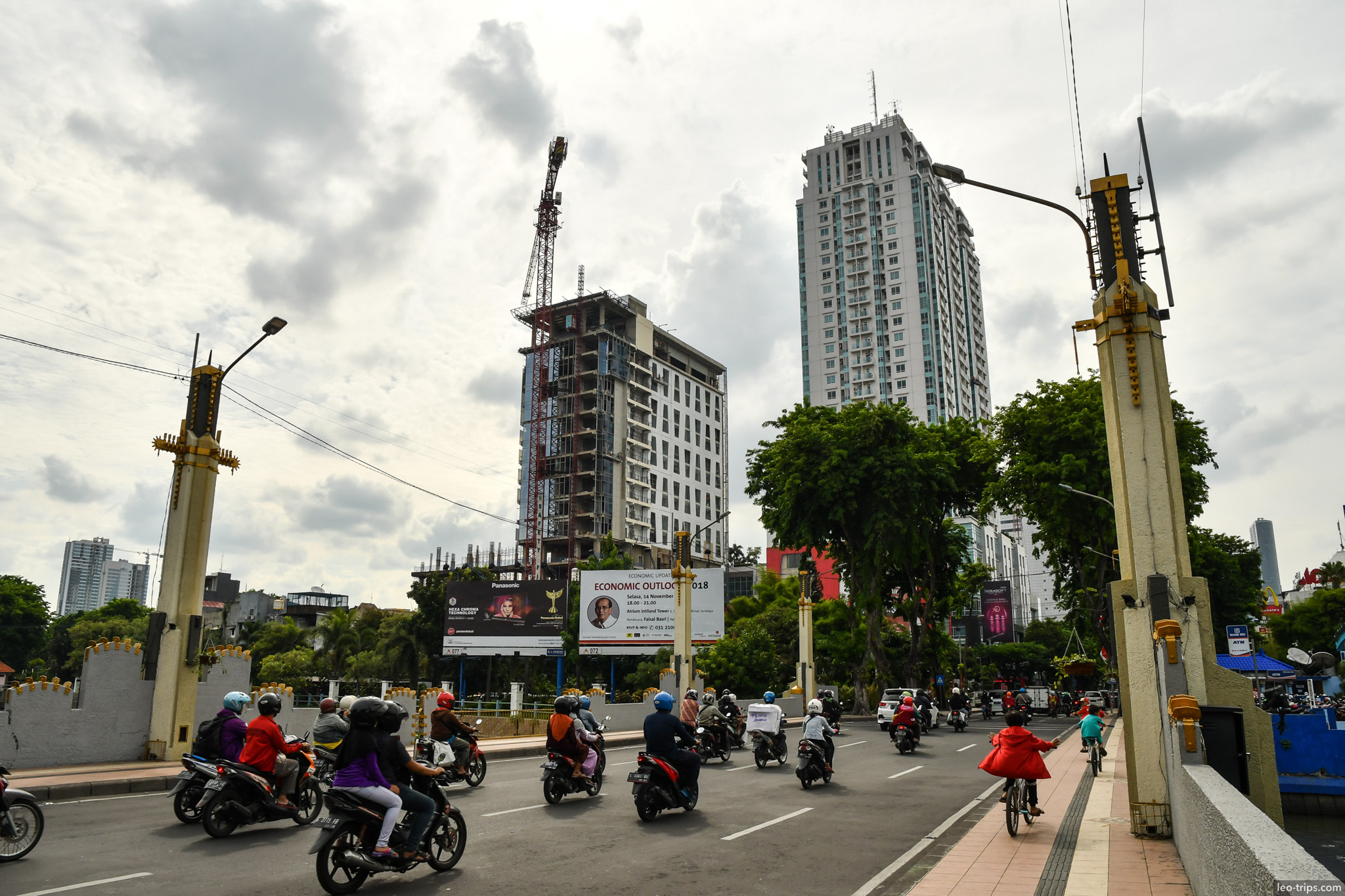 busy bridge motorcycles construction cranes surabaya surabaya