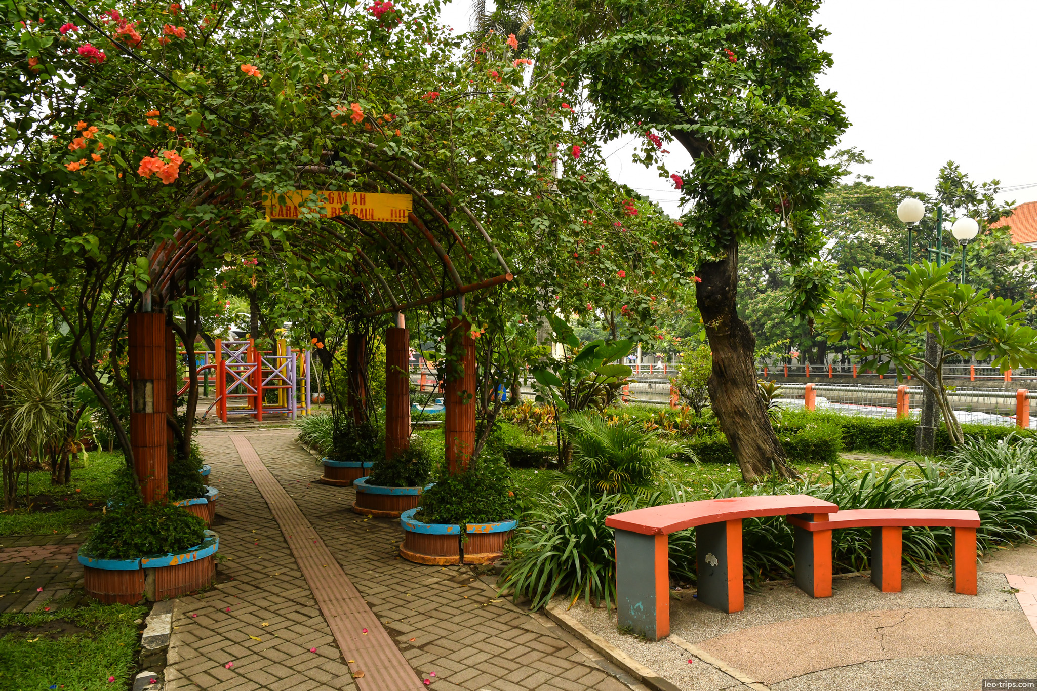 flower arch walkway colorful benches city park surabaya