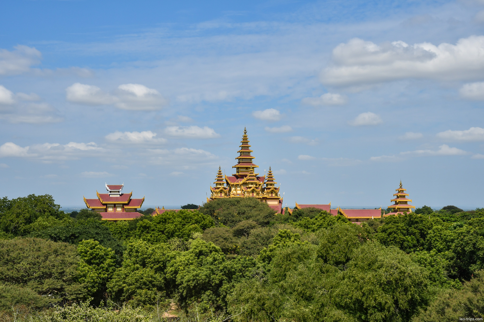 bagan golden palace spires above trees bagan