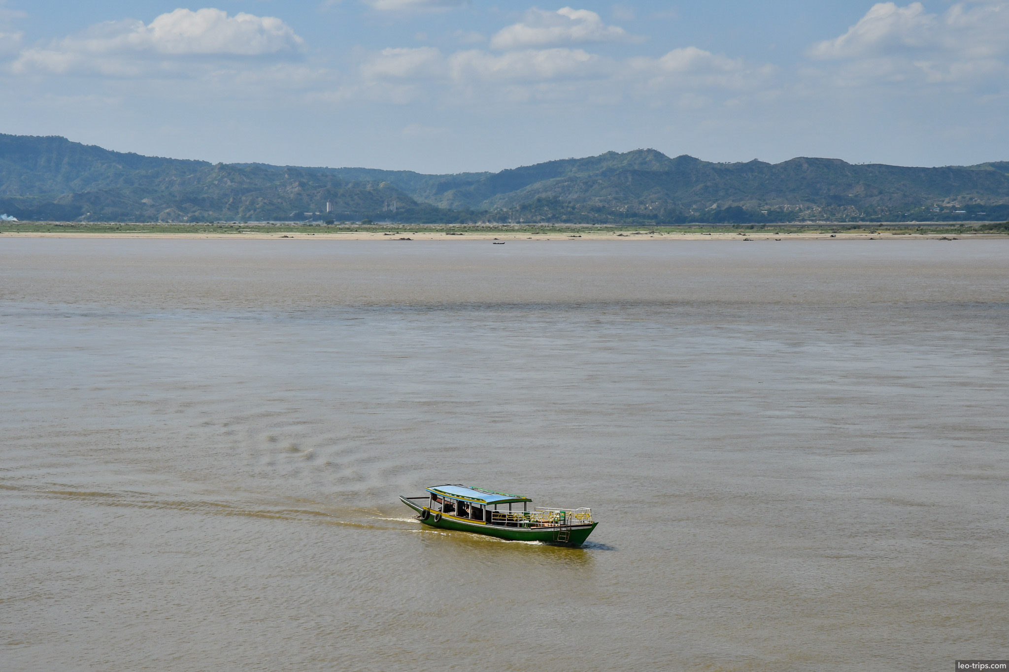 boat crossing irrawaddy river mountains bagan bagan