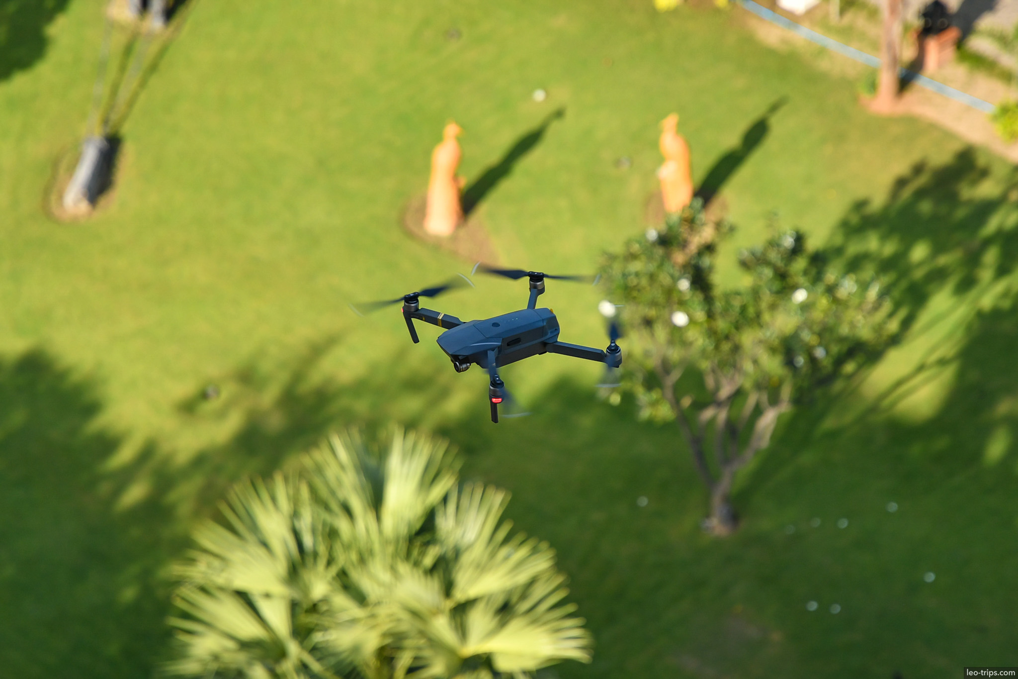 drone flying over garden with statues bagan bagan