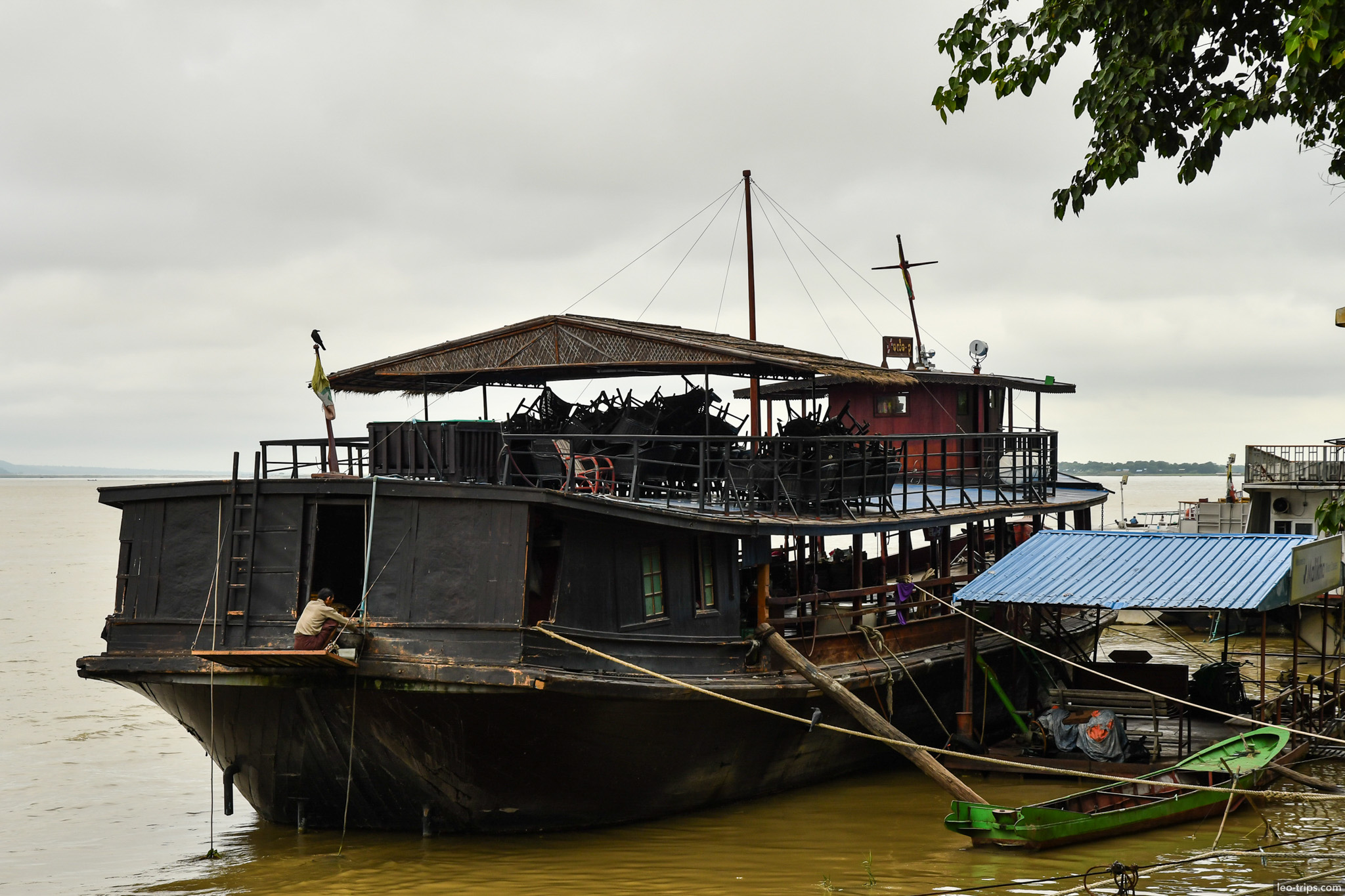 abandoned black houseboat irrawaddy river mandalay