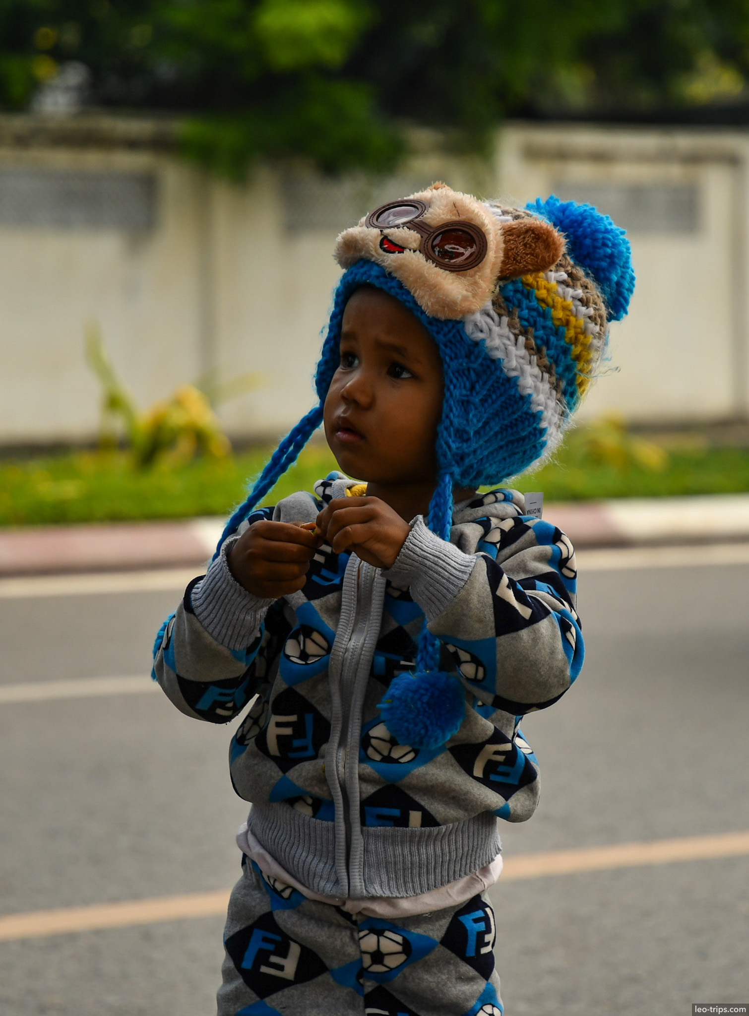 burmese toddler in animal knit hat street mandalay