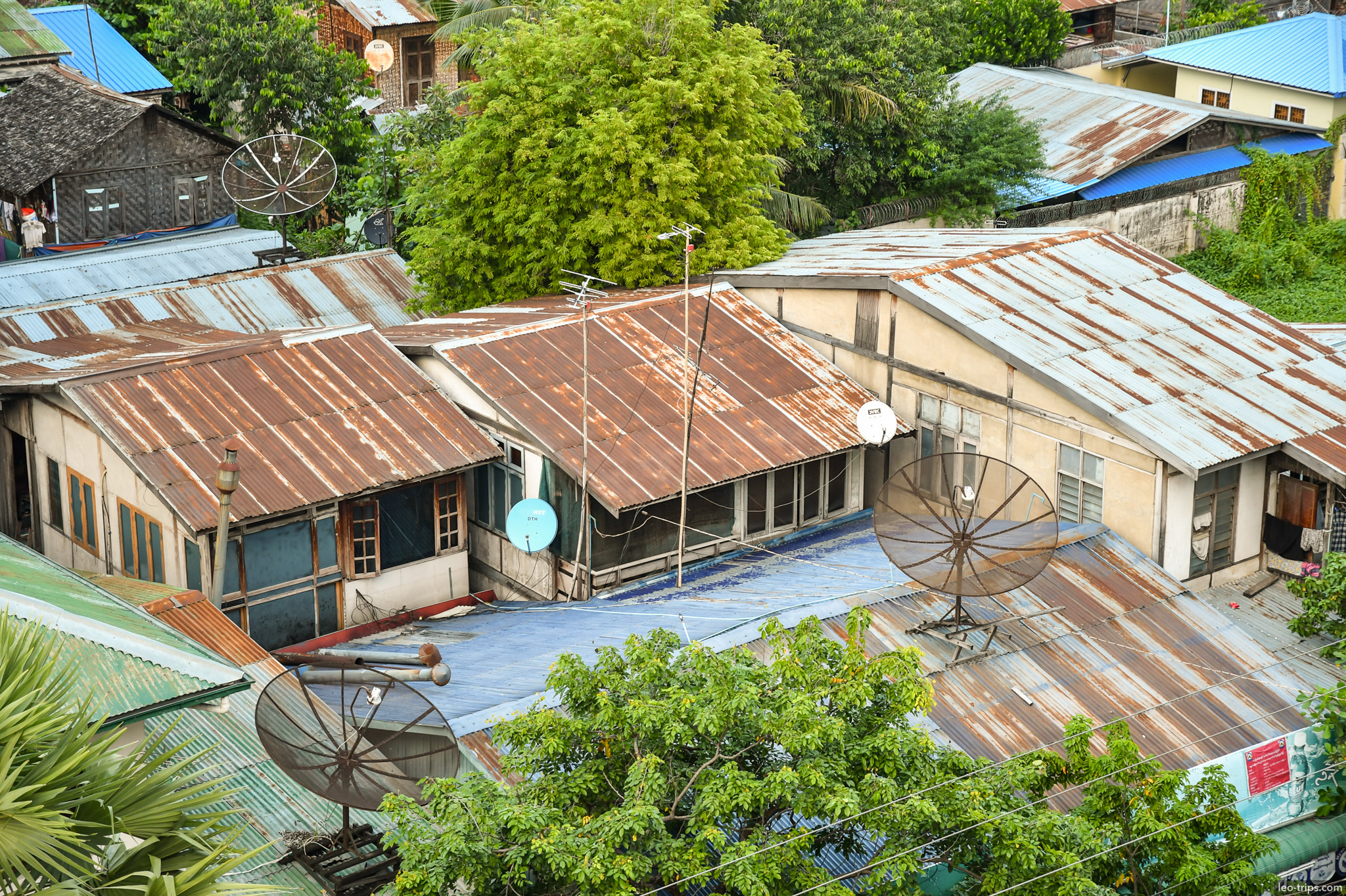 rusty tin rooftops satellite dishes mandalay mandalay