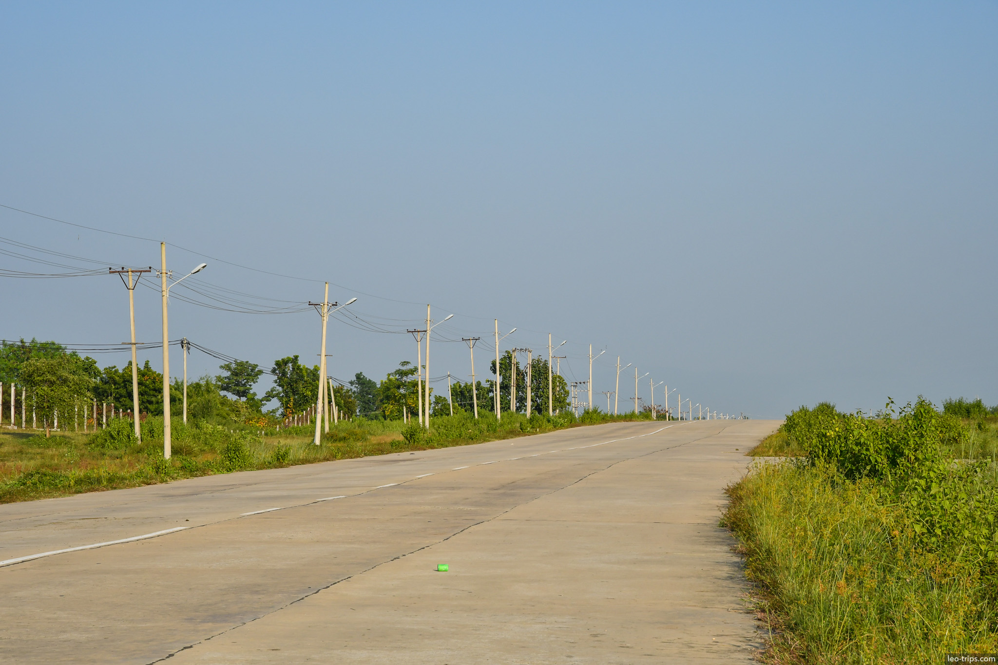 empty wide highway with power lines naypyidaw naypyidaw