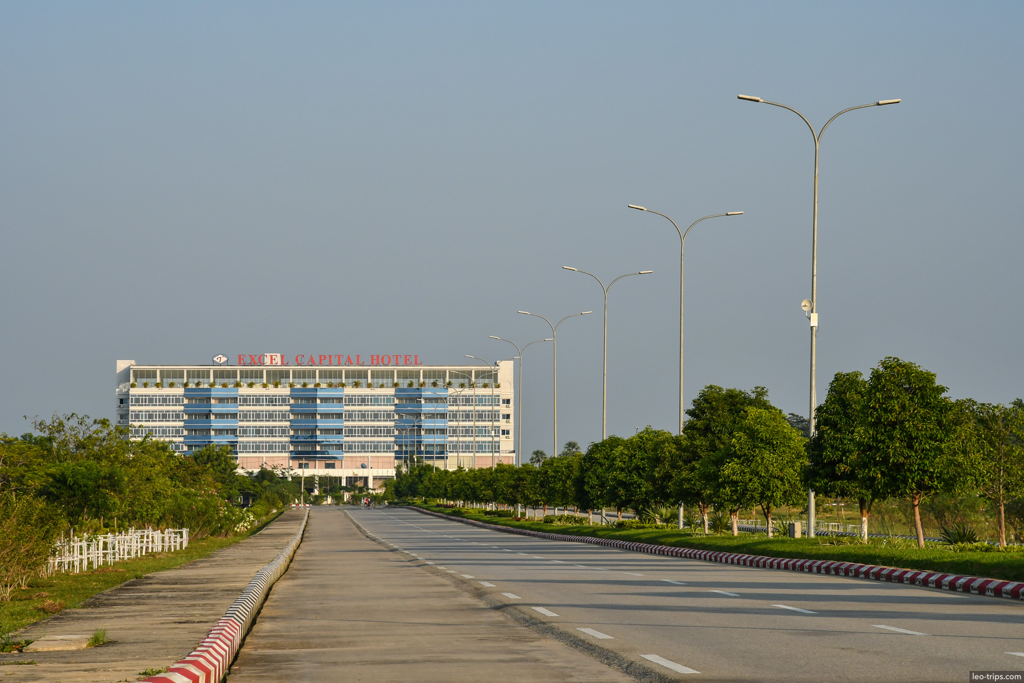hotel building at end of deserted road naypyidaw naypyidaw