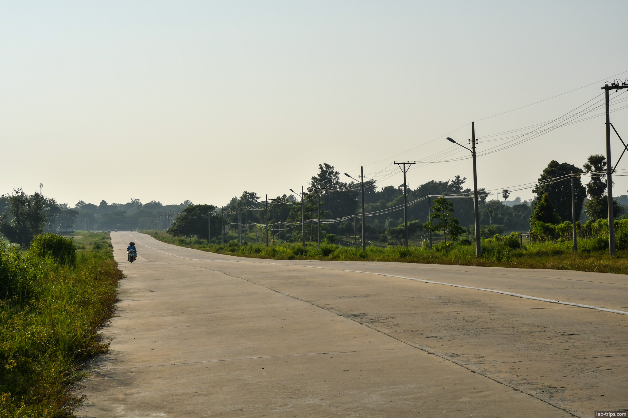lone motorcyclist on empty highway naypyidaw naypyidaw