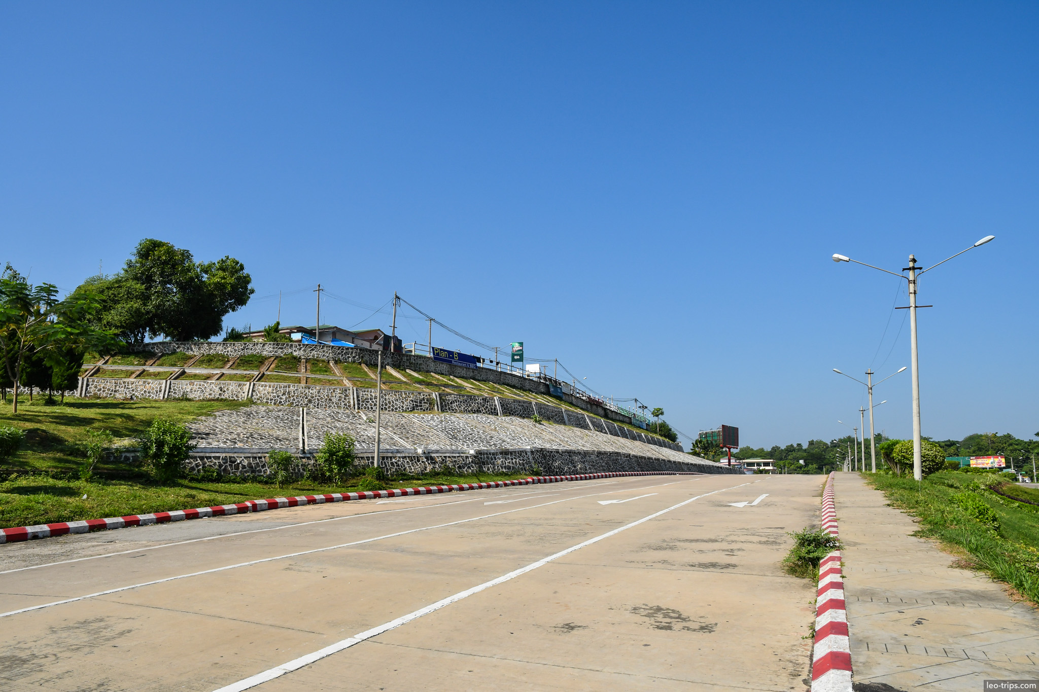 road along stone retaining wall near dam naypyidaw naypyidaw