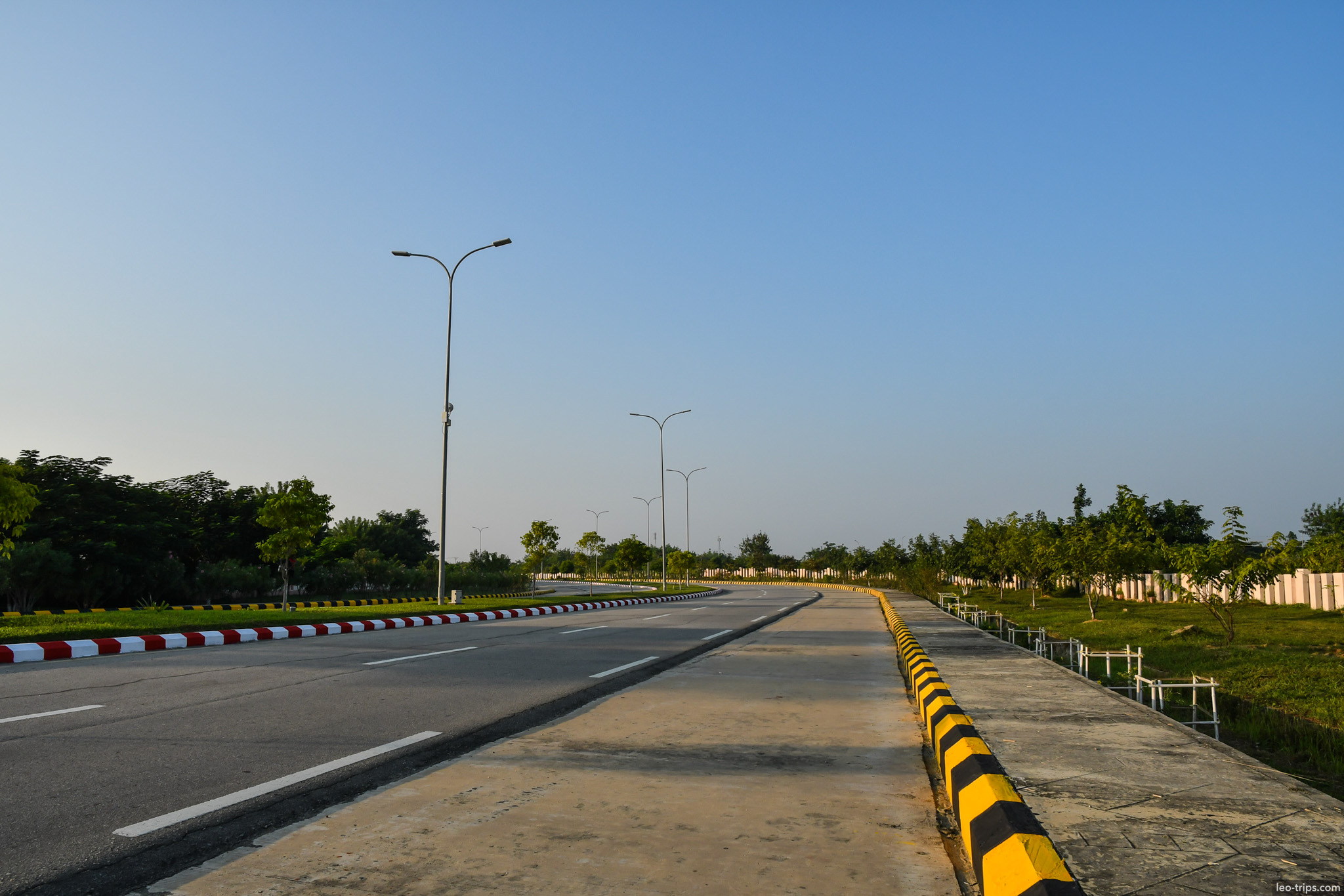 wide intersection with yellow black barriers naypyidaw naypyidaw