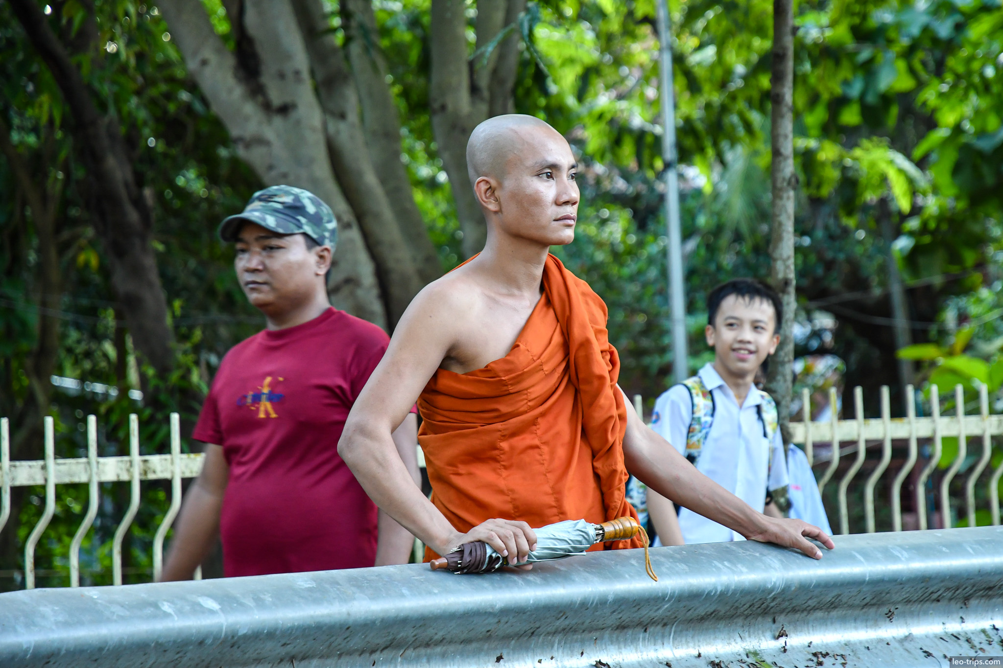 yangon buddhist monk orange robe pedestrian bridge yangon