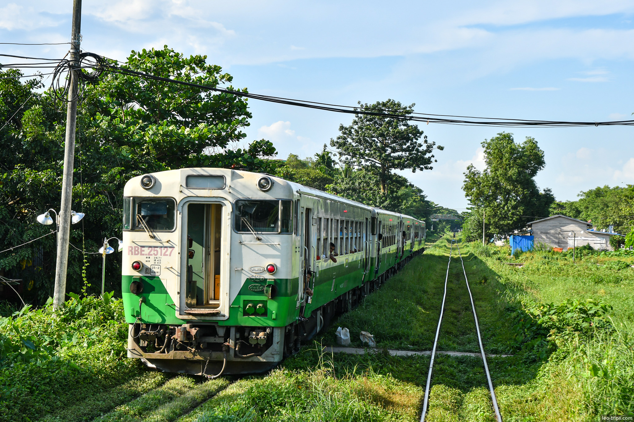 yangon circular train green white passing suburbs yangon