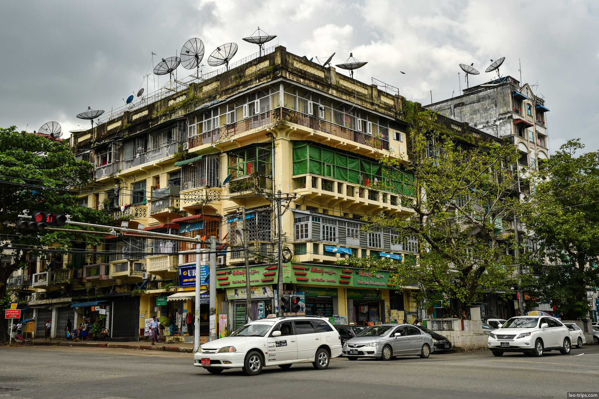 yangon corner apartment building satellite dishes intersection yangon