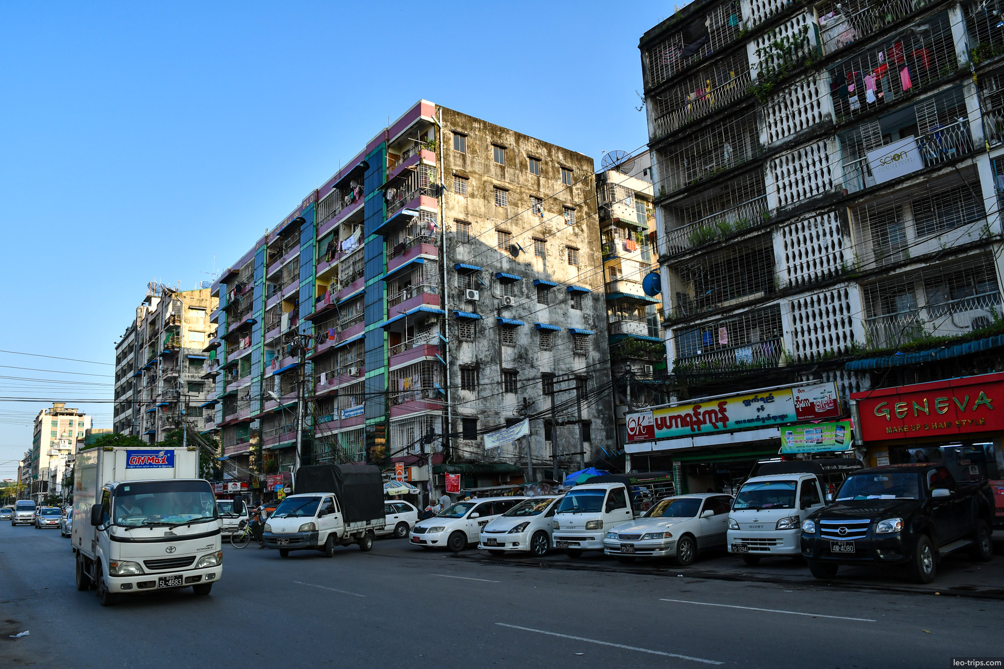 yangon downtown apartment buildings street traffic morning yangon