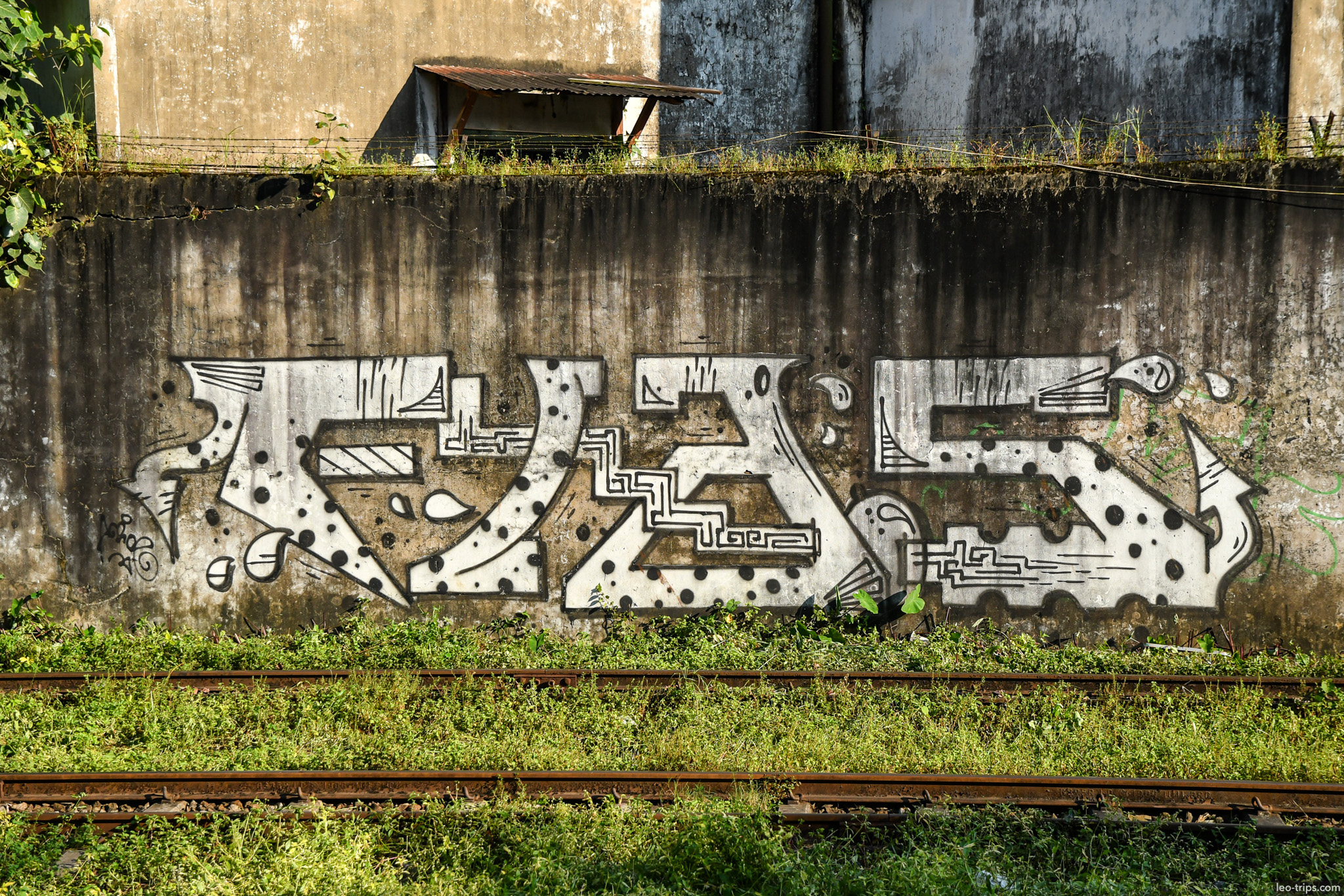 yangon graffiti burmese script railway wall yangon