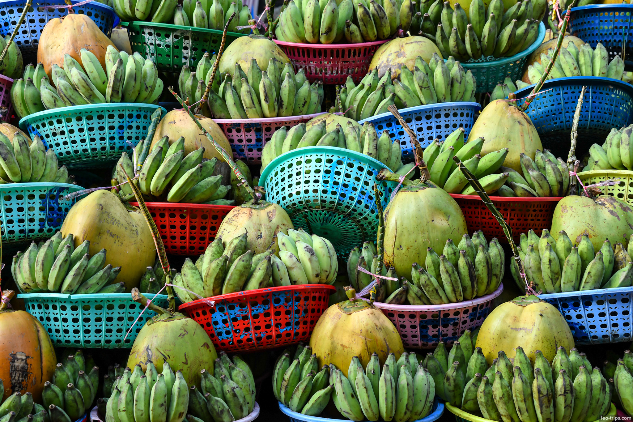 yangon green bananas in colorful plastic baskets market yangon