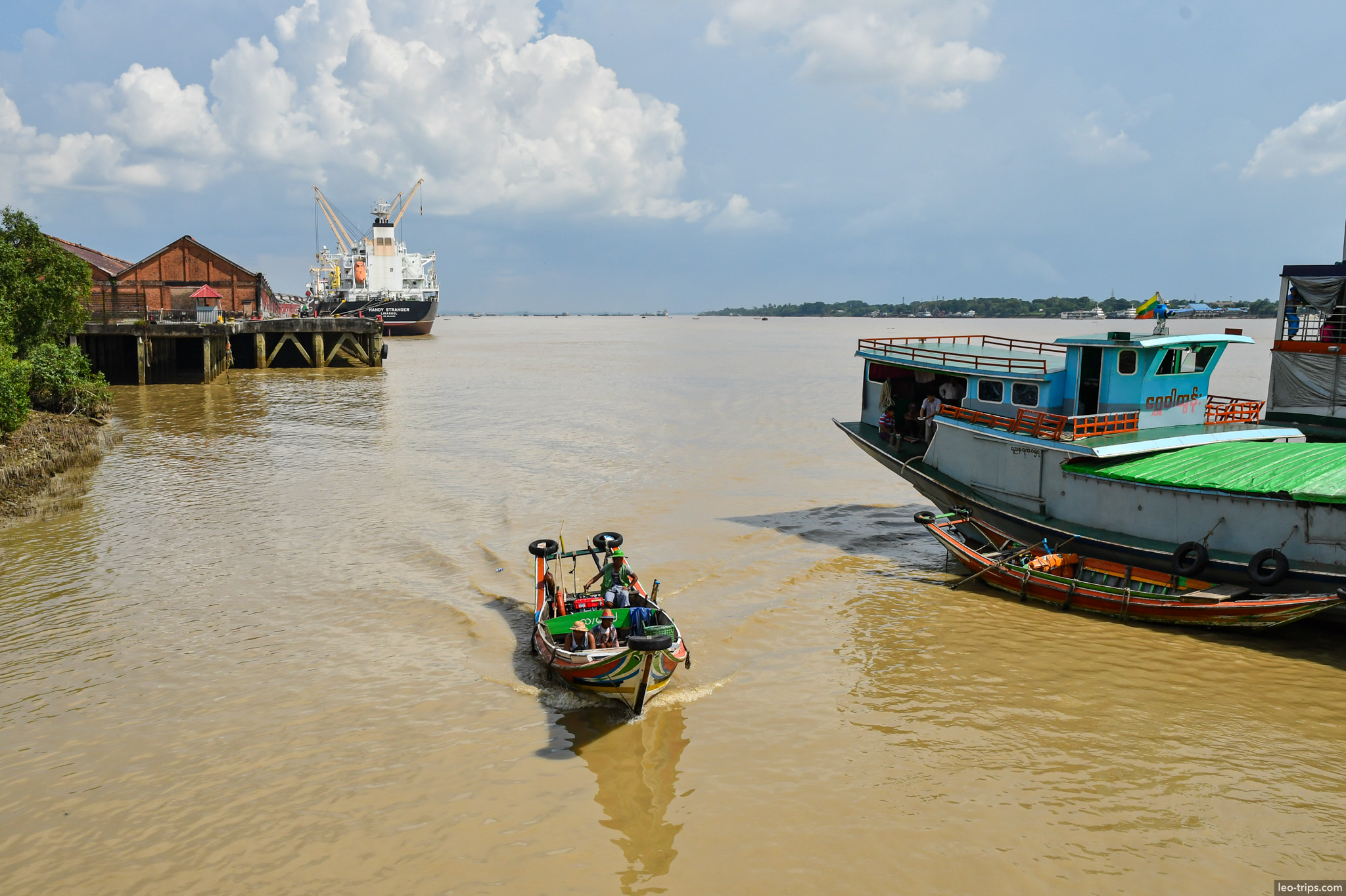yangon irrawaddy river longtail boat cargo ship background yangon