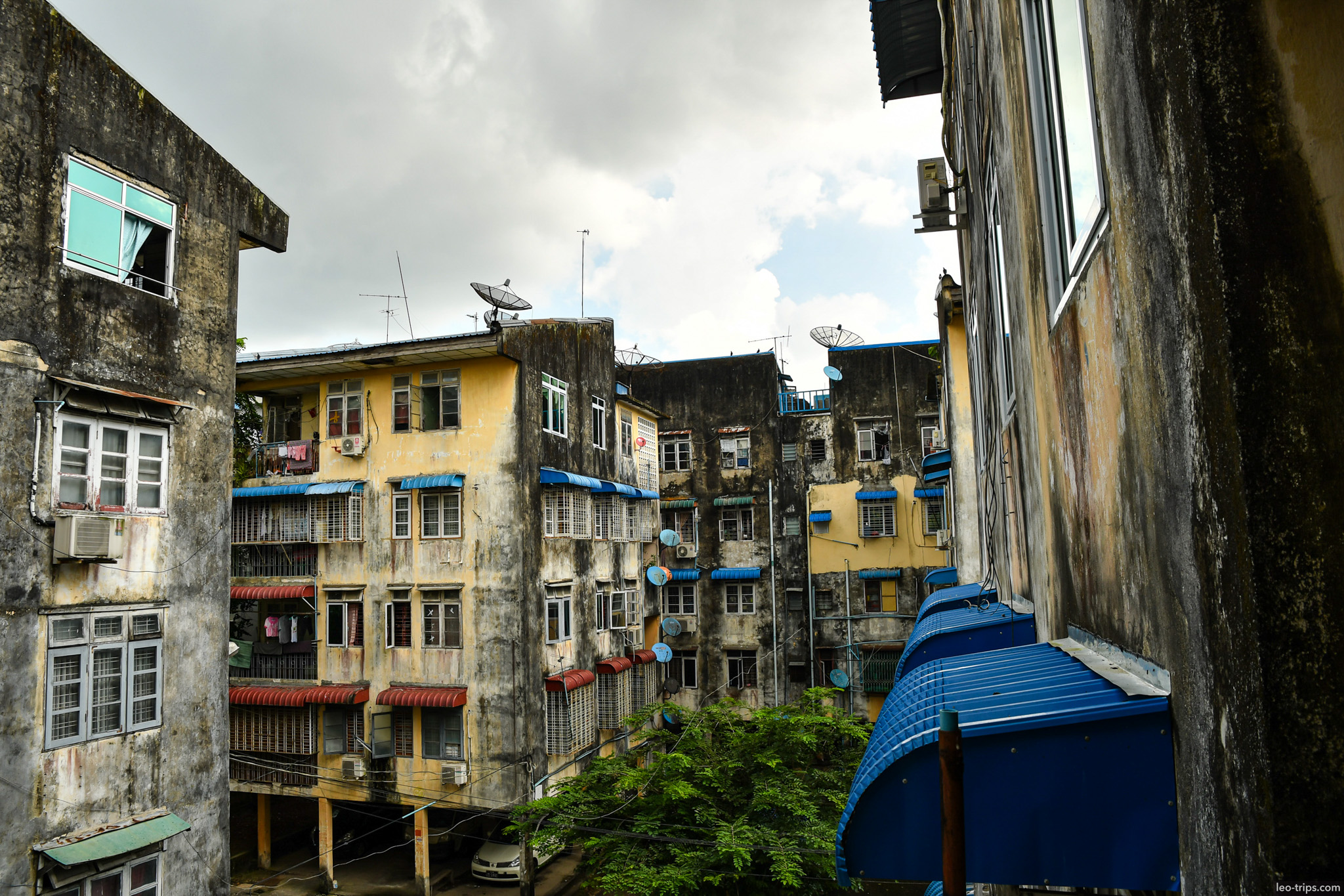 yangon old apartment buildings courtyard satellite dishes yangon