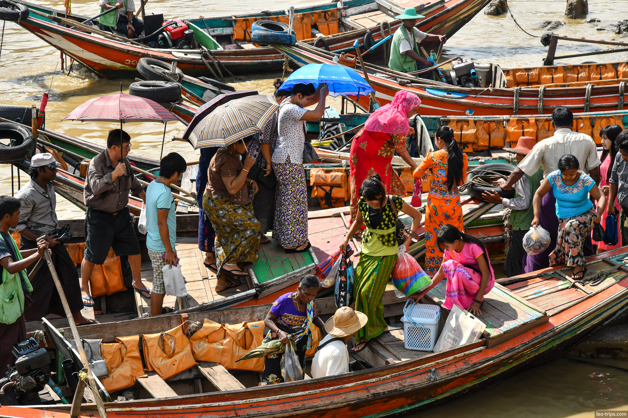 yangon river ferry passengers boarding wooden boats yangon
