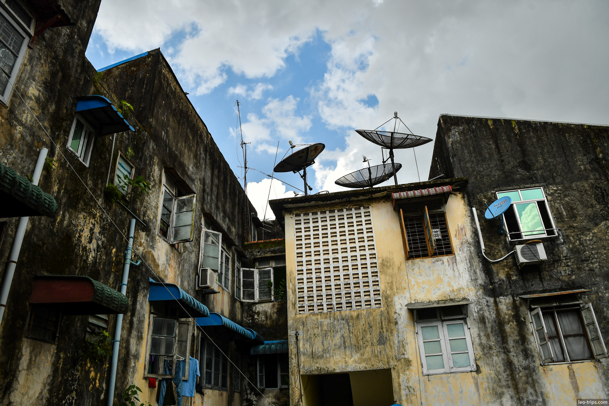 yangon run down apartment rooftop satellite dishes yangon