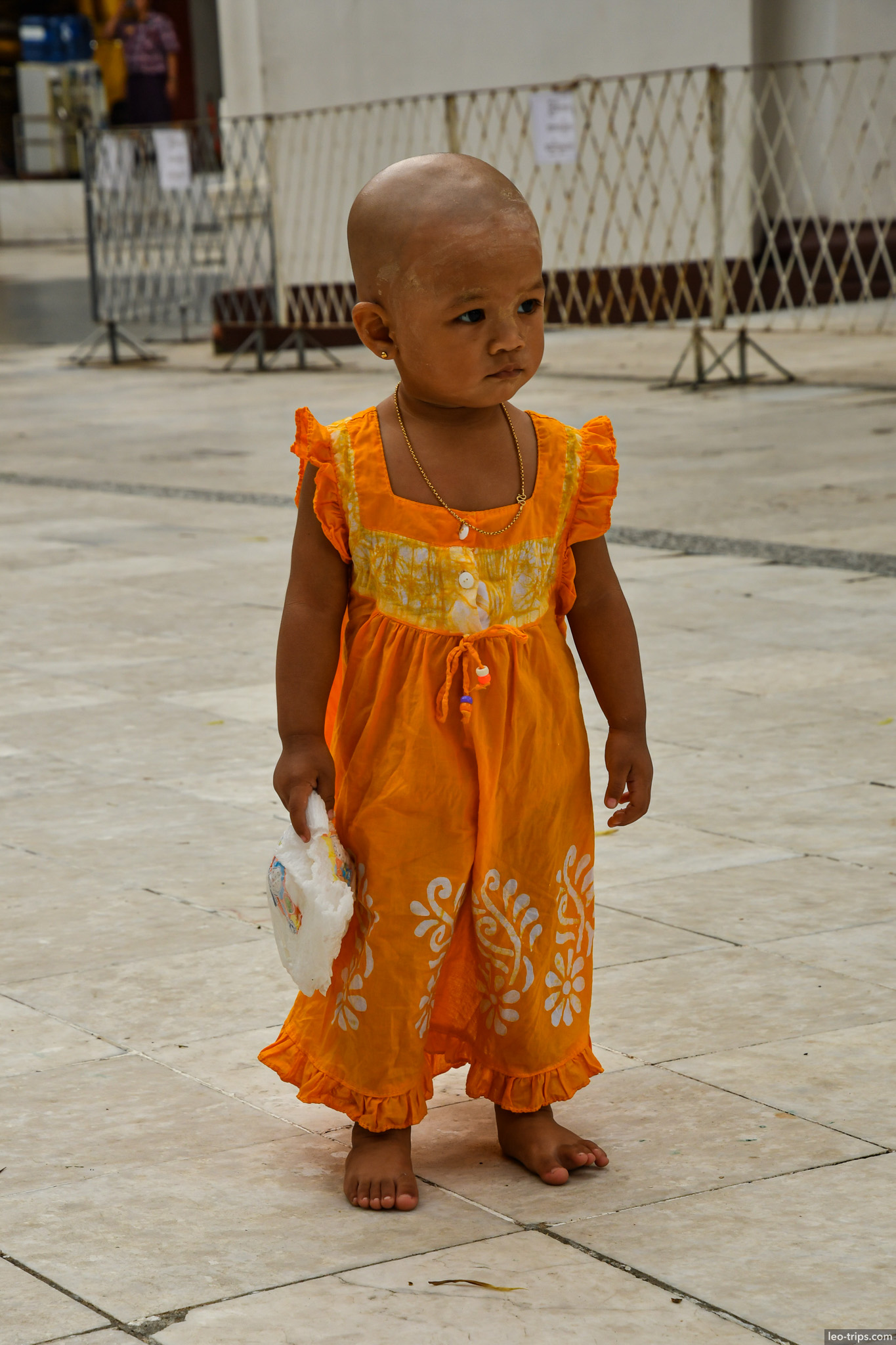 yangon shwedagon pagoda burmese toddler orange dress shaved head yangon