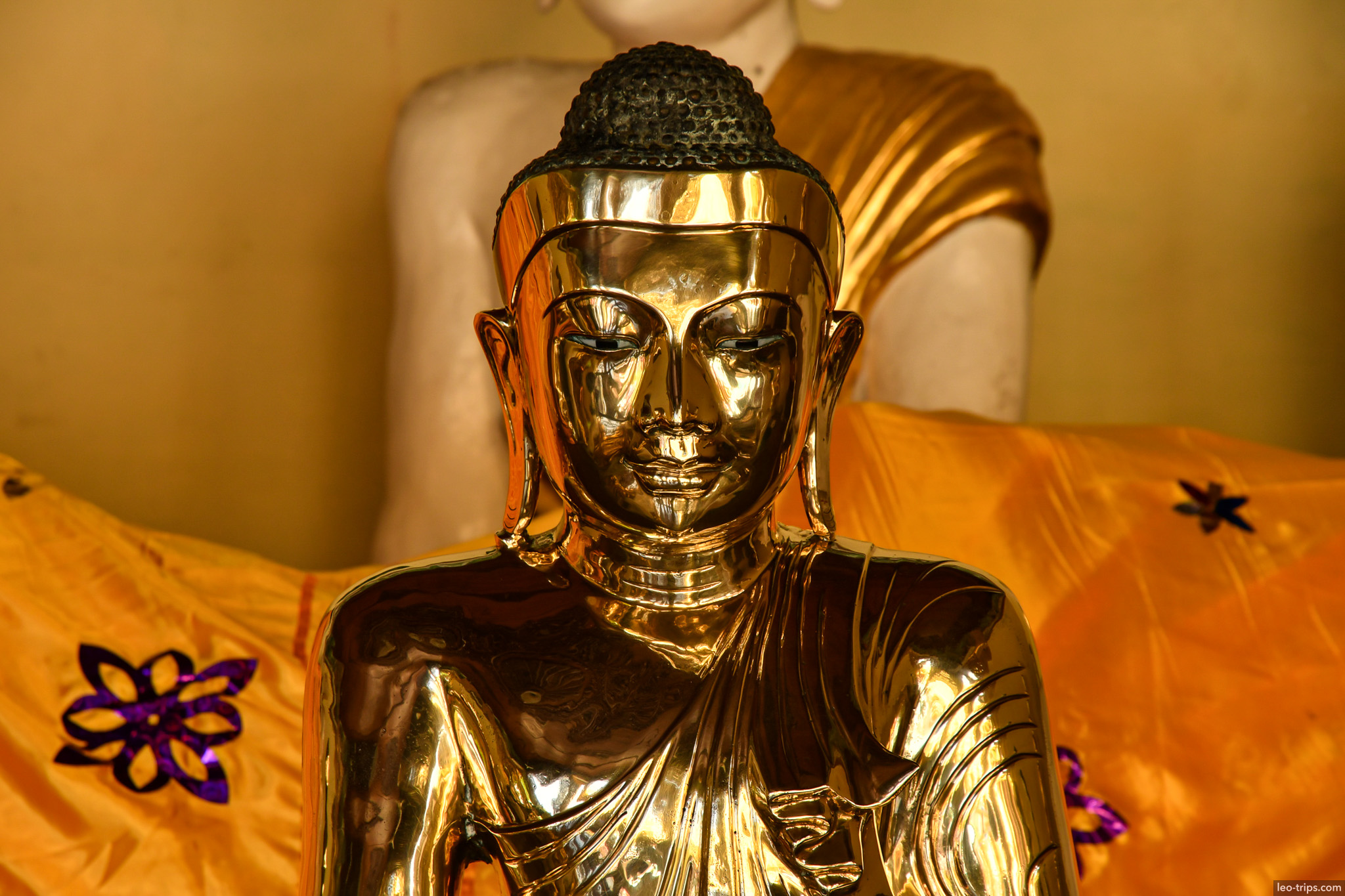 yangon shwedagon pagoda polished gold buddha face closeup yangon