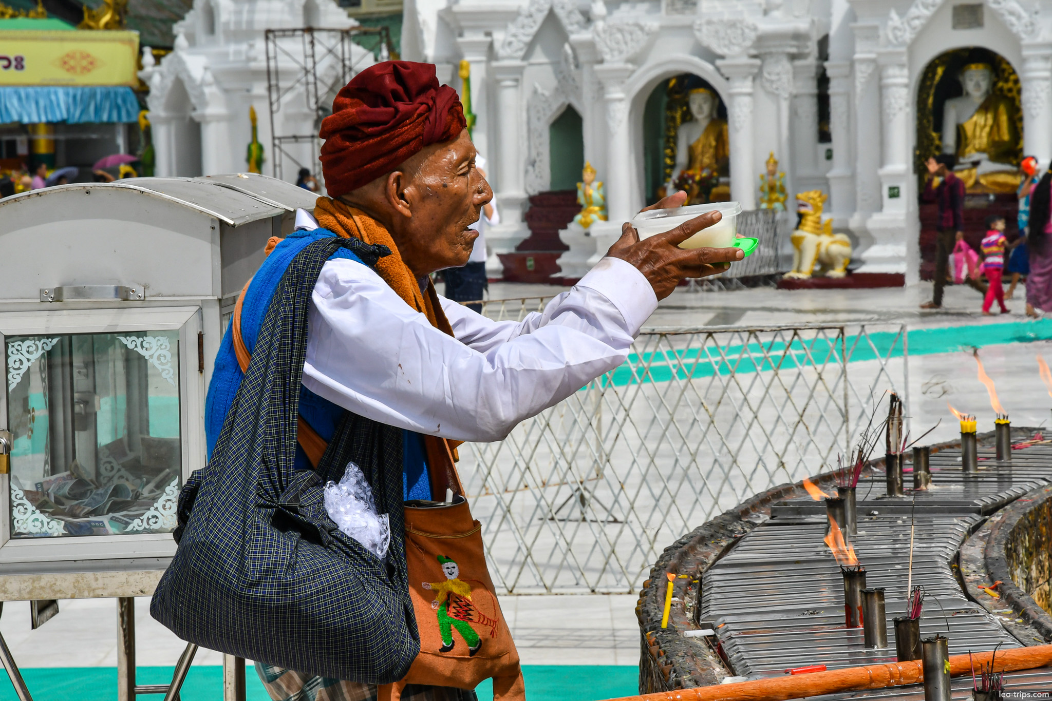 yangon shwedagon pagoda vendor offering candles incense yangon