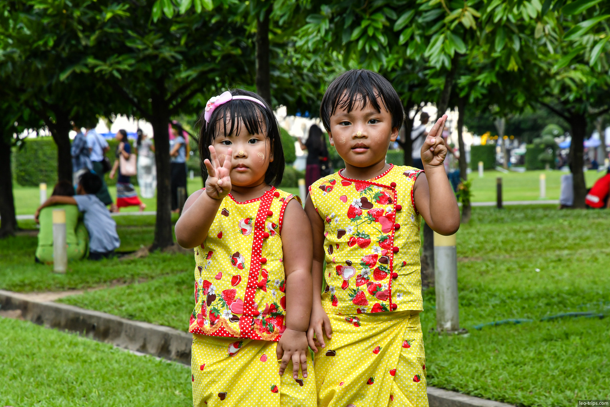 yangon two burmese girls matching yellow outfits thanaka park yangon