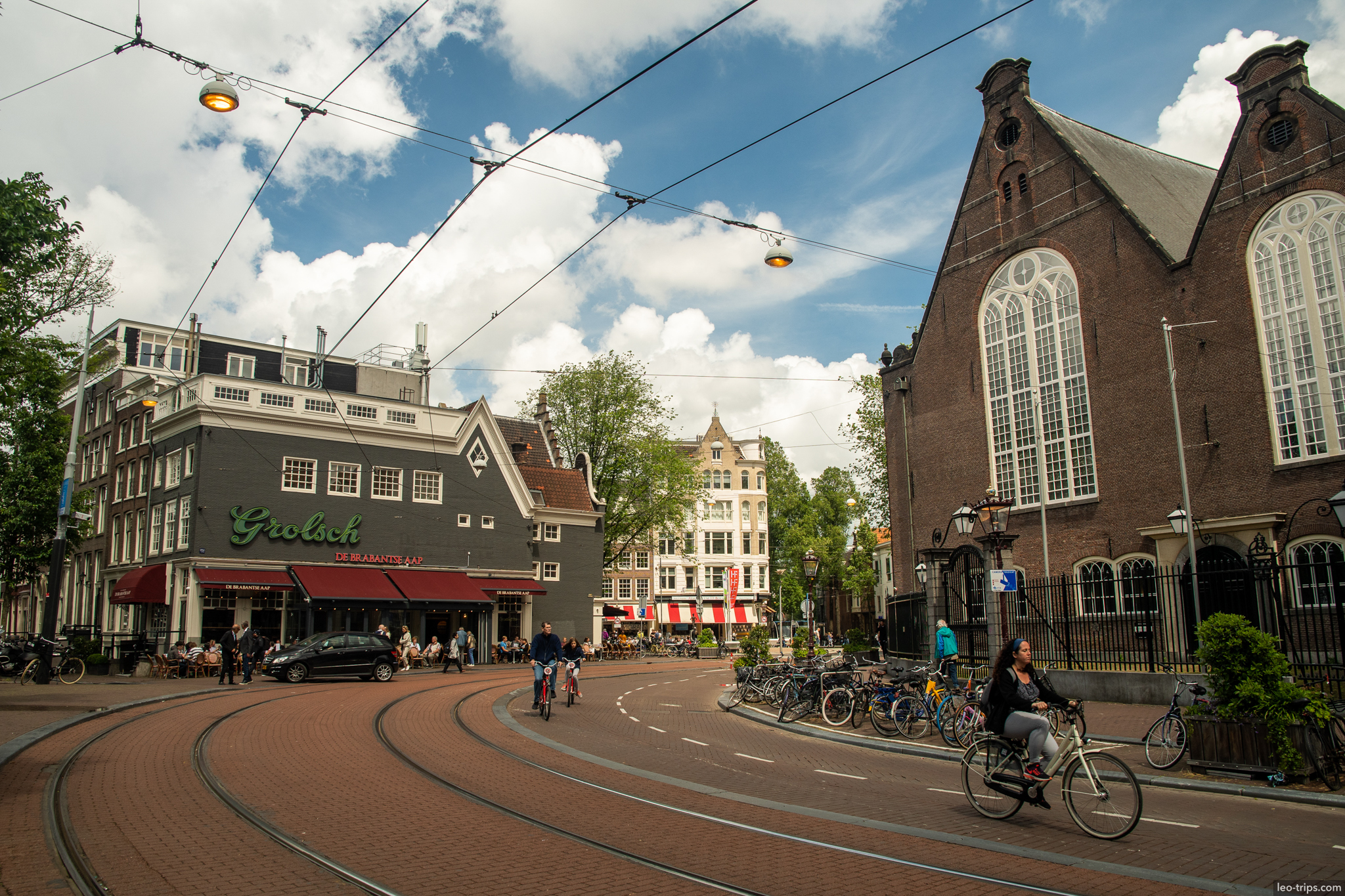 amsterdam street grolsch bar tram tracks church amsterdam
