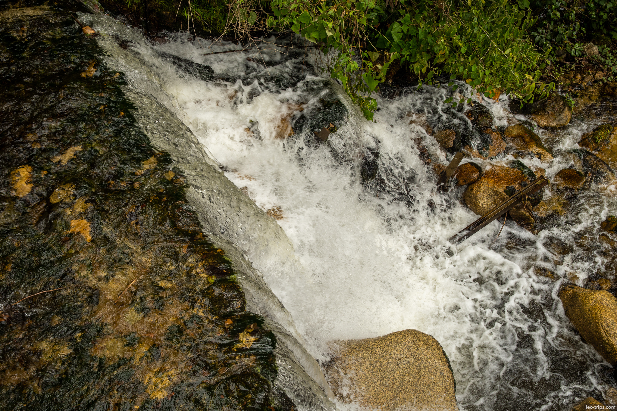 mountain stream waterfall top view rocks around aguas calientes