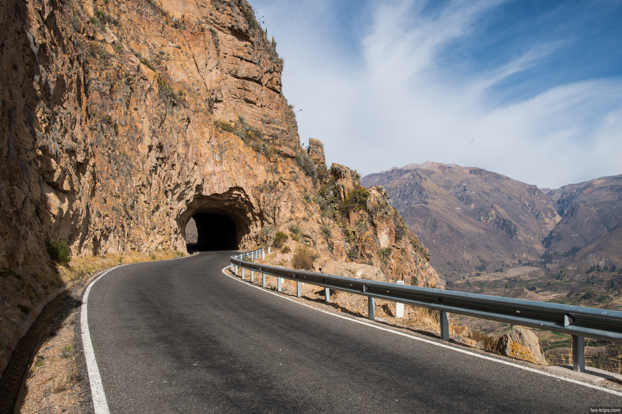 mountain road tunnel carved in rock colca colca canyon
