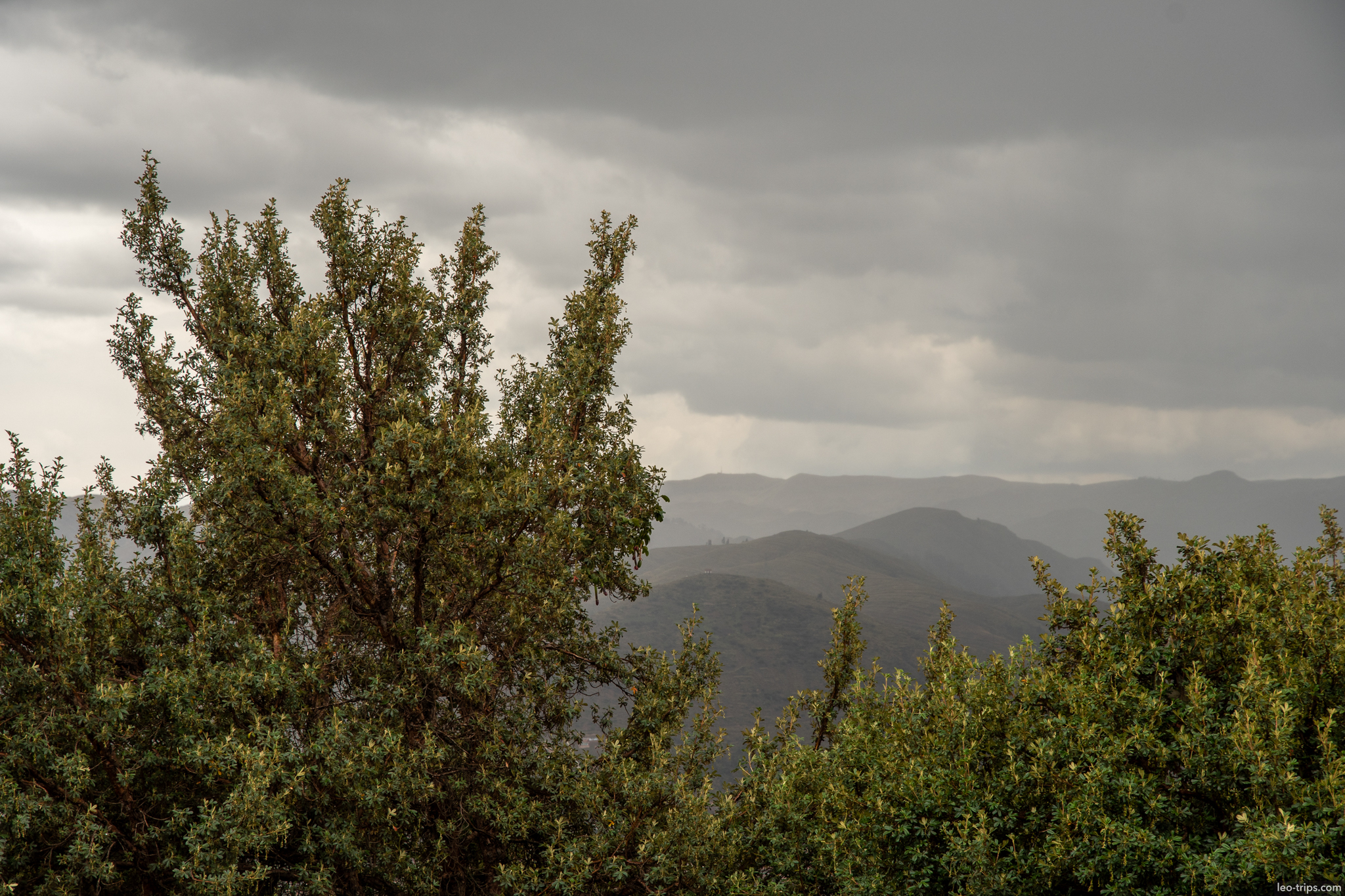 andean mountain landscape stormy sky trees cusco