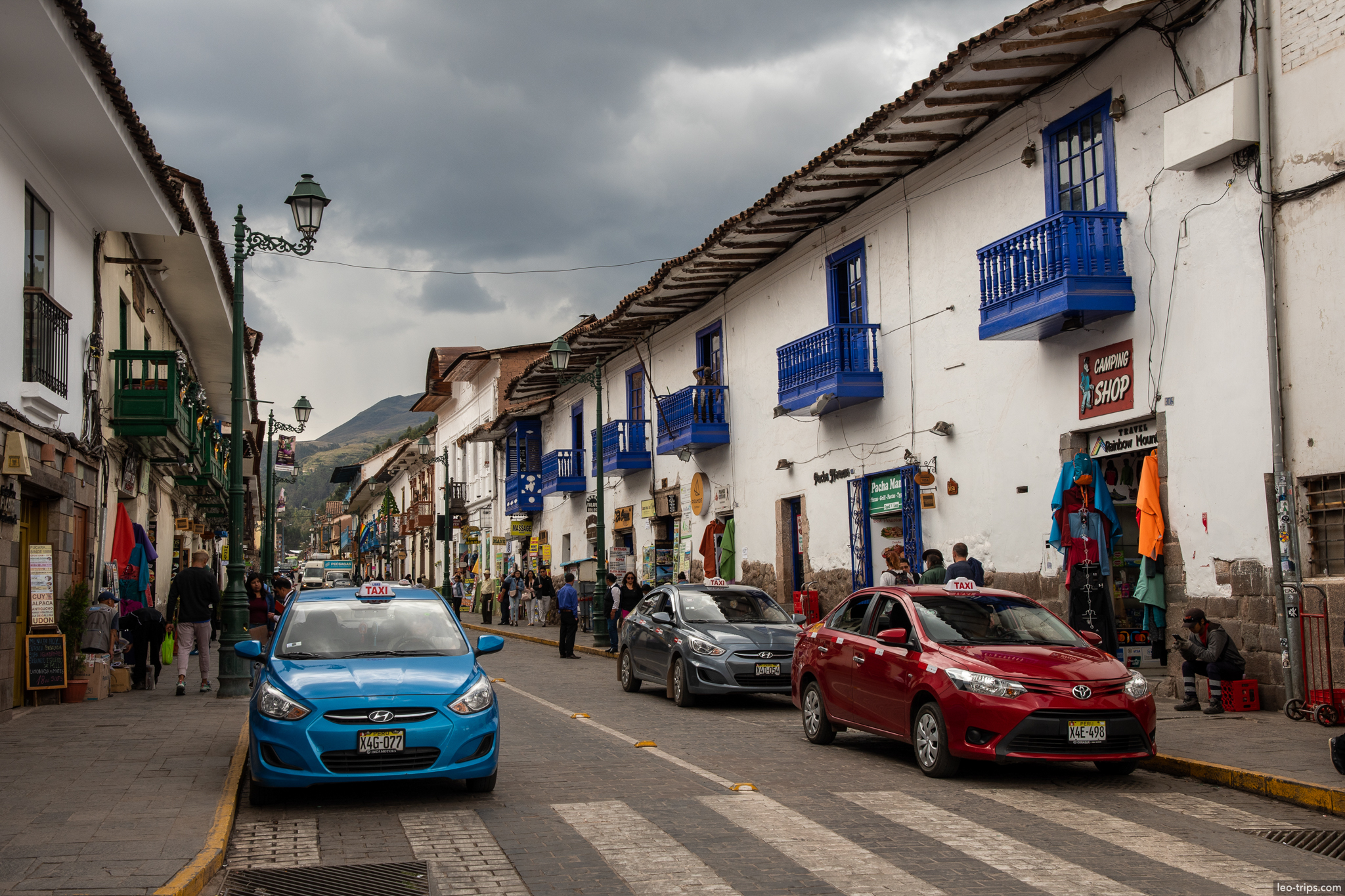 cusco main street taxis blue balconies camping shop cusco