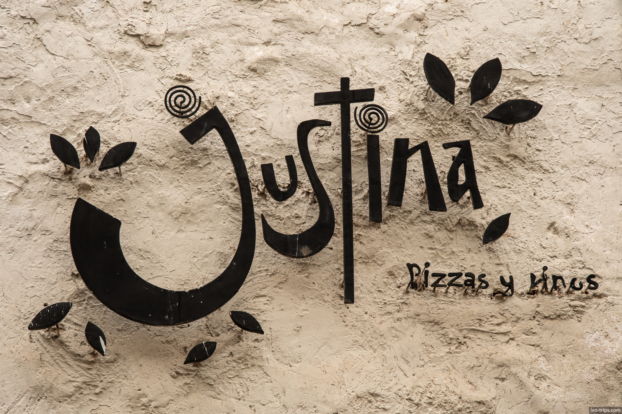 justina pizzas y vinos restaurant sign cusco