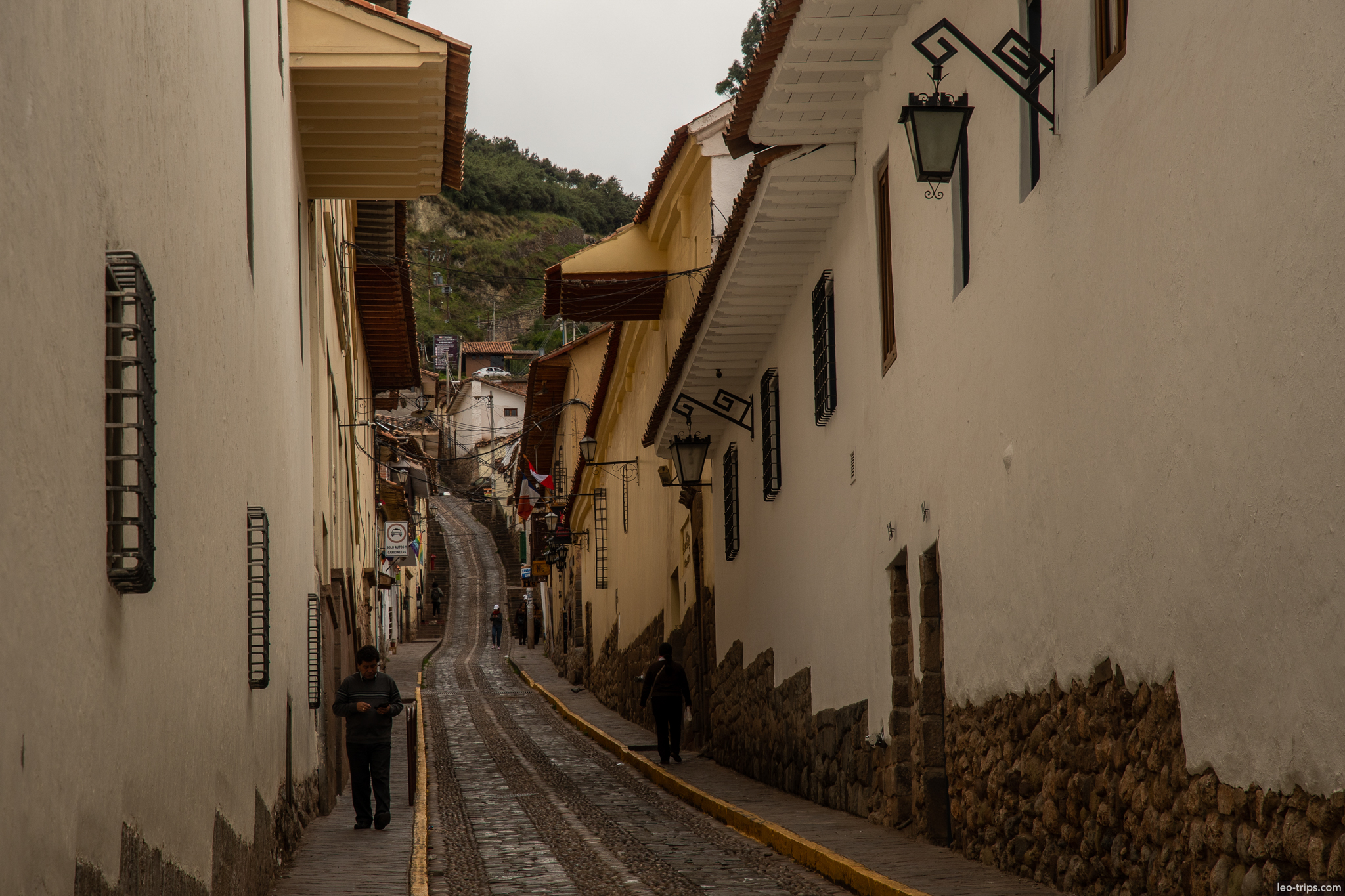 narrow colonial street cusco downhill cusco