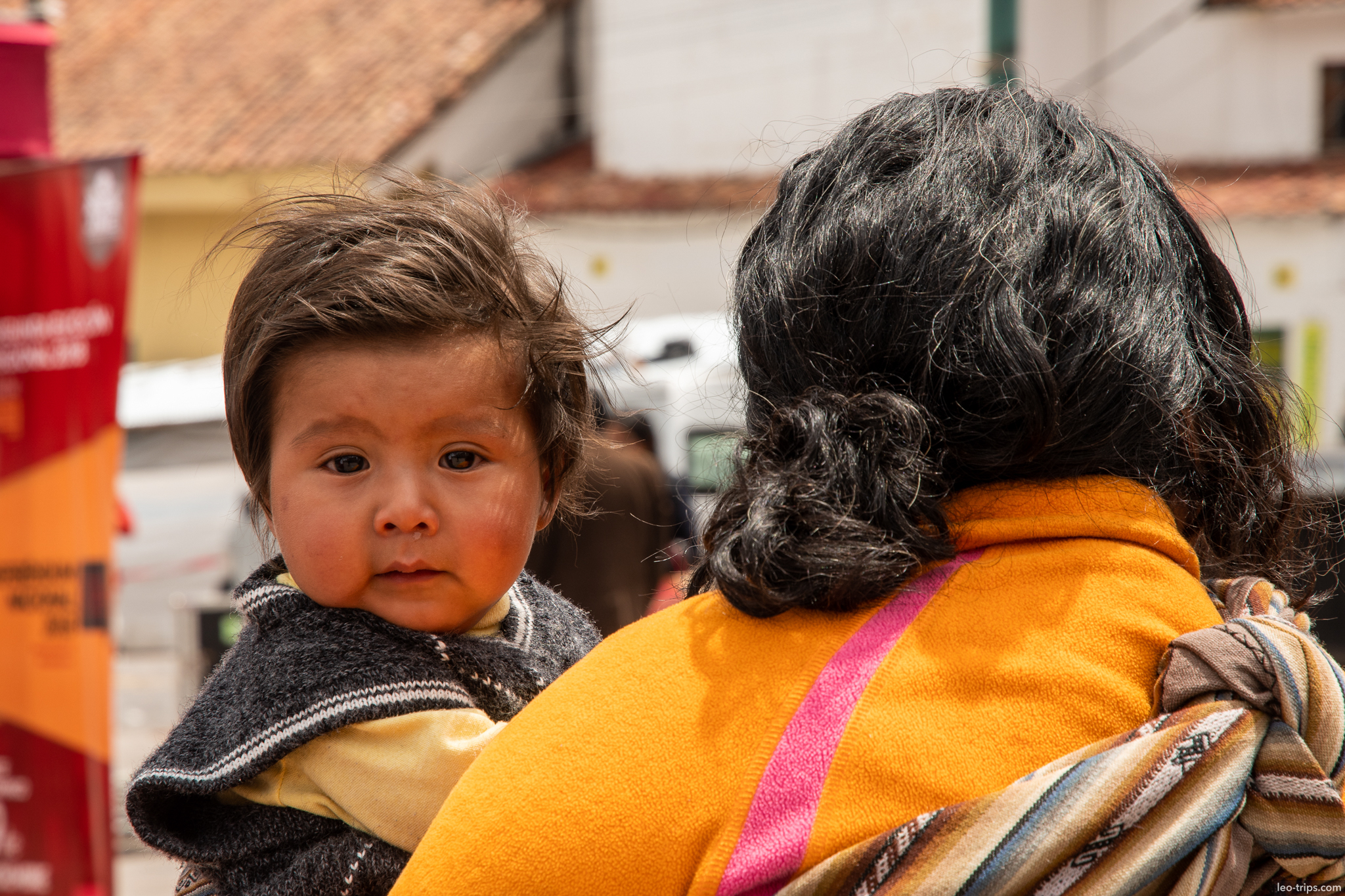 peruvian baby carried on mothers back cusco