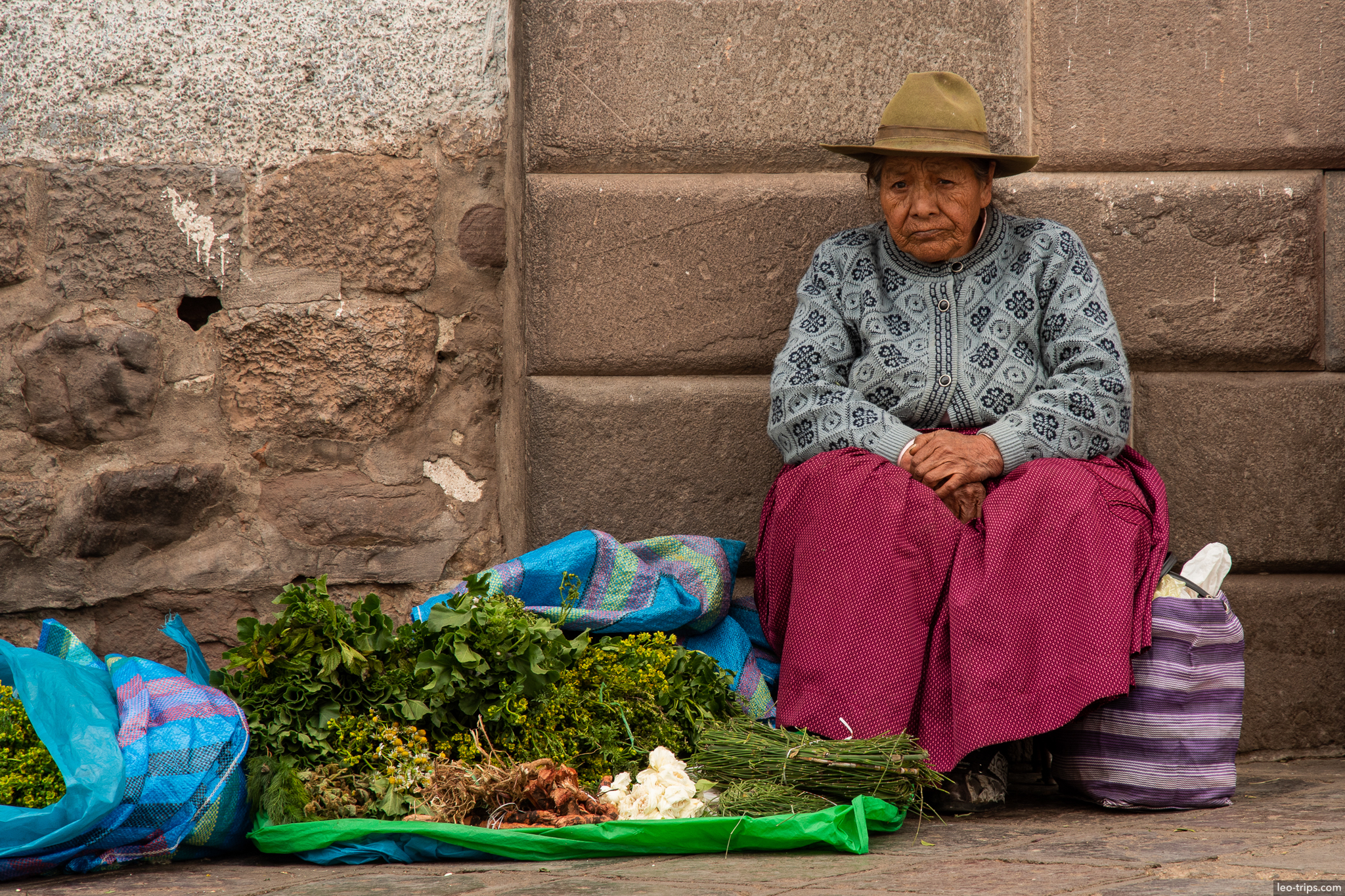 quechua elder selling herbs vegetables street cusco
