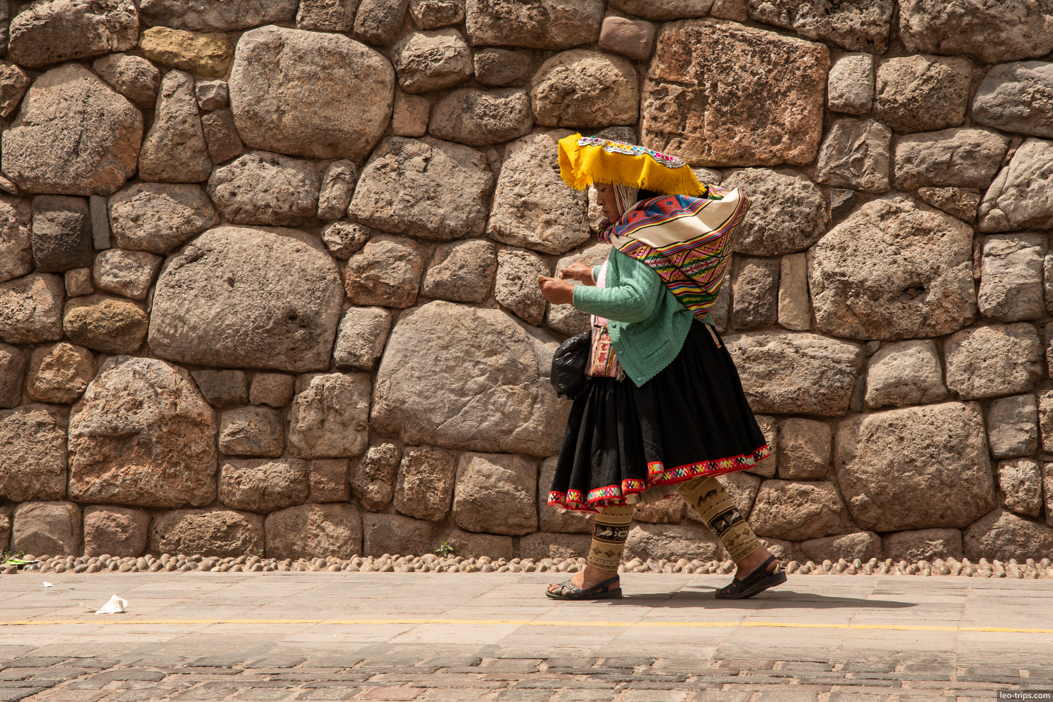 quechua woman traditional dress inca wall cusco
